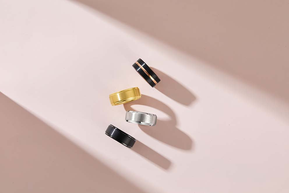 assortment of four wedding bands