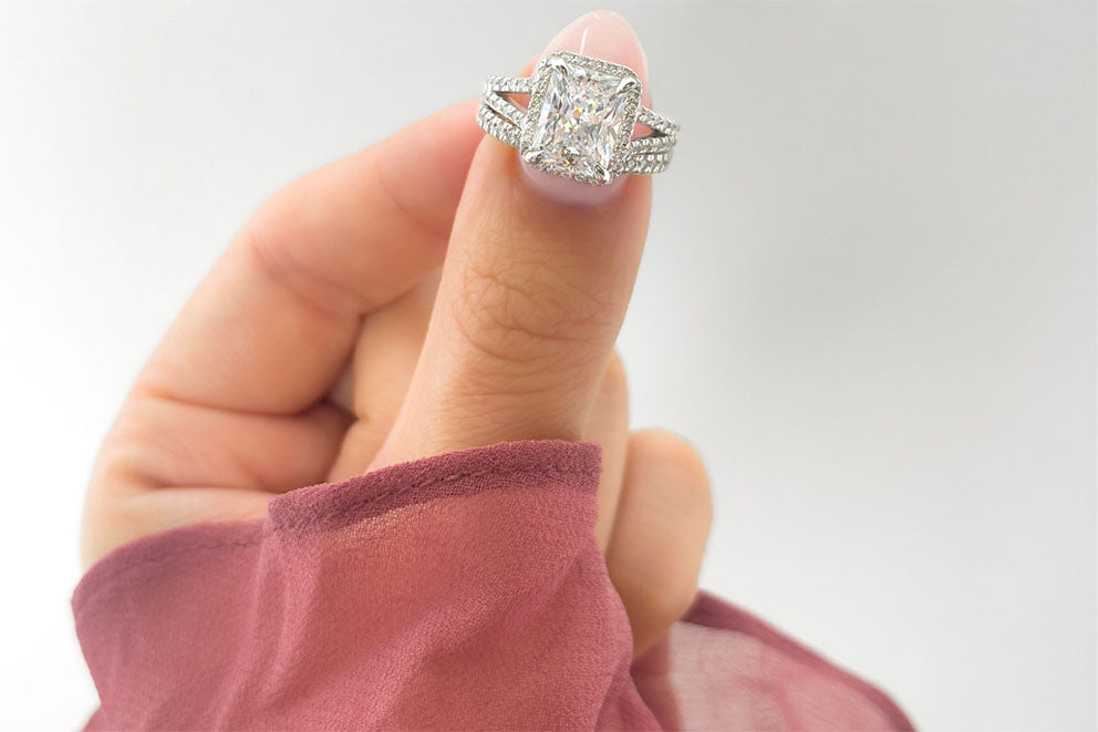 holding up diamond ring