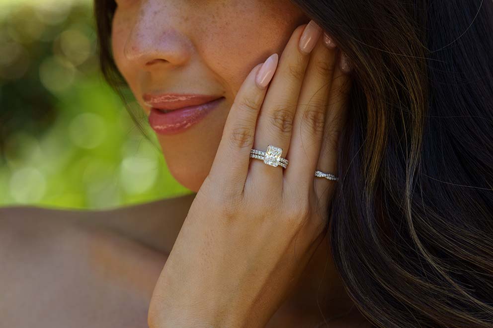 portrait woman wearing gold rings