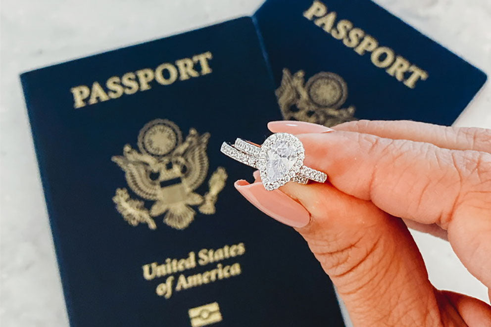 wedding ring set with passports in background