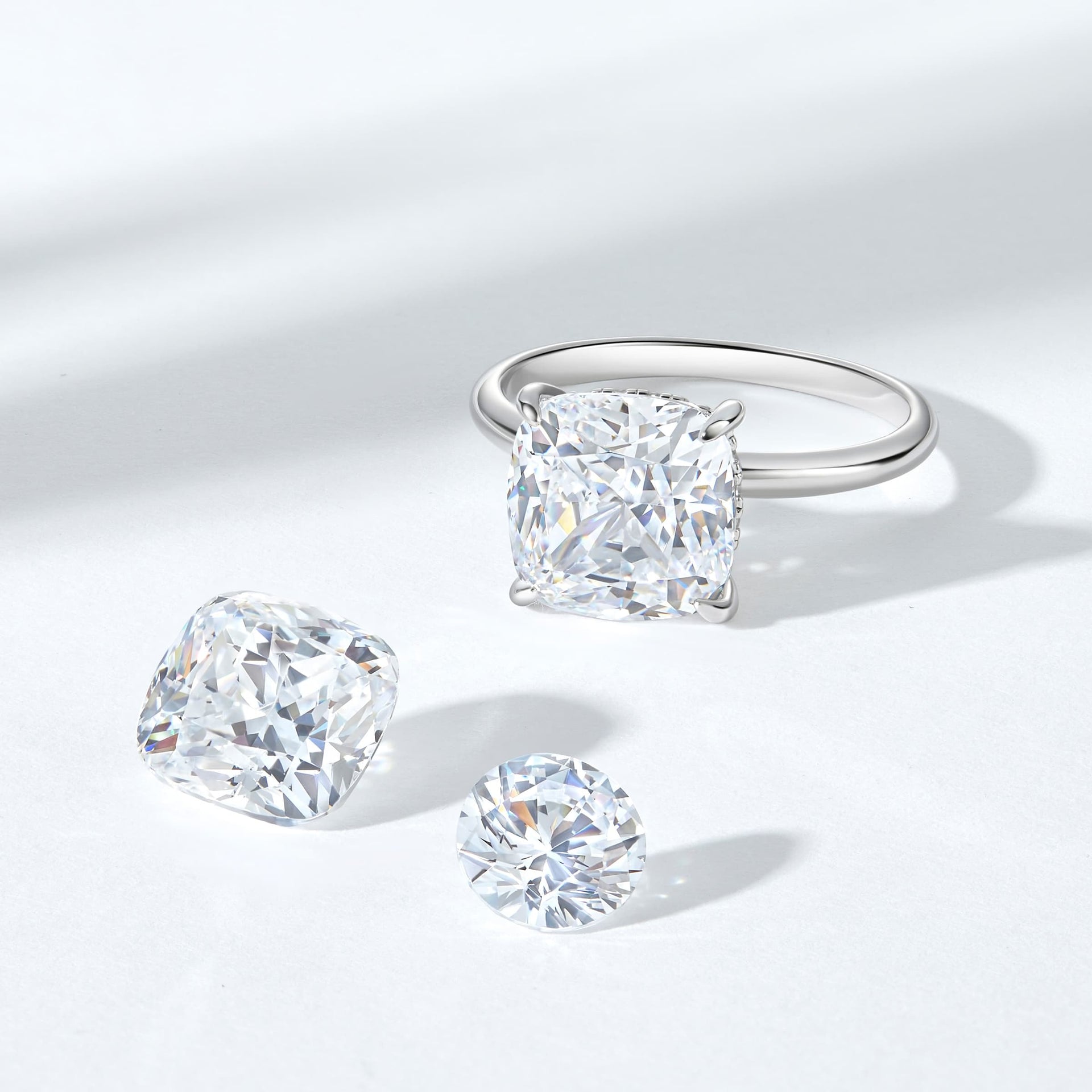 Silver 3 carat cushion cut solitaire engagement ring on white background