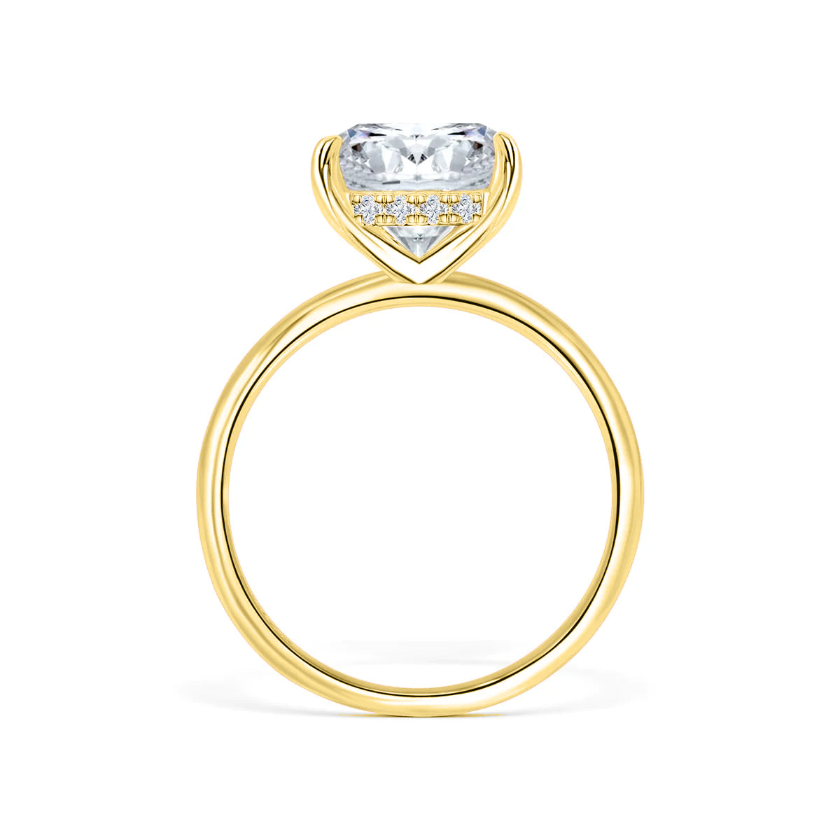 Close-up side view of The Claire yellow gold cushion-cut solitaire engagement ring with hidden halo on white background