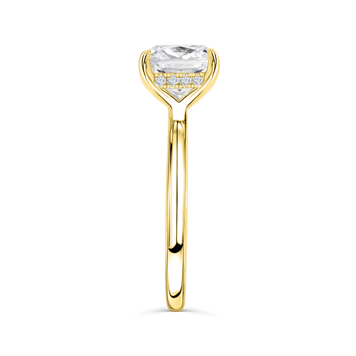 Close-up side profile of The Claire gold engagement ring with cushion-cut simulated diamond and hidden halo setting on white background
