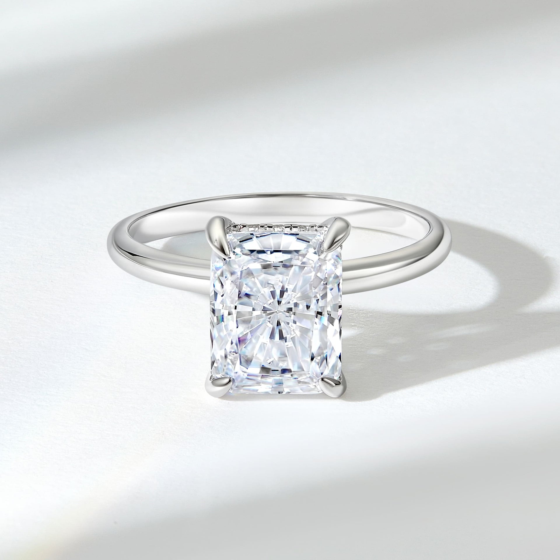 3 ct silver solitaire engagement ring with radiant cut on white background