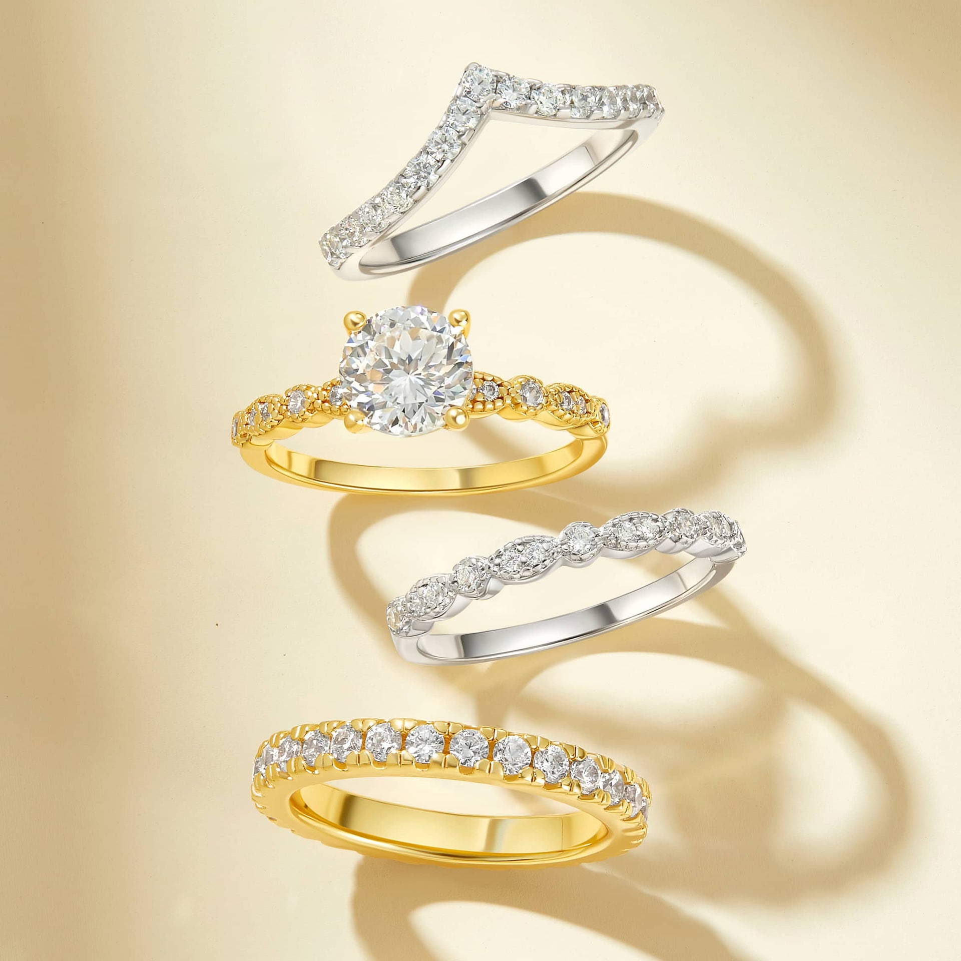 gorgeous flatlay with the sofia engagement ring and 3 complimentary wedding bands in silver and gold