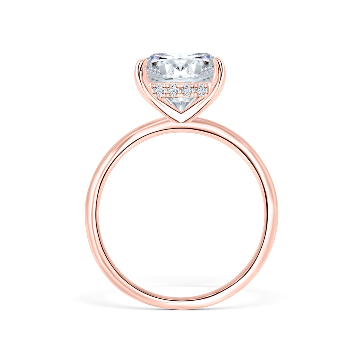 Close-up side view of The Claire rose gold engagement ring featuring hidden halo and cushion-cut simulated diamond solitaire on white background