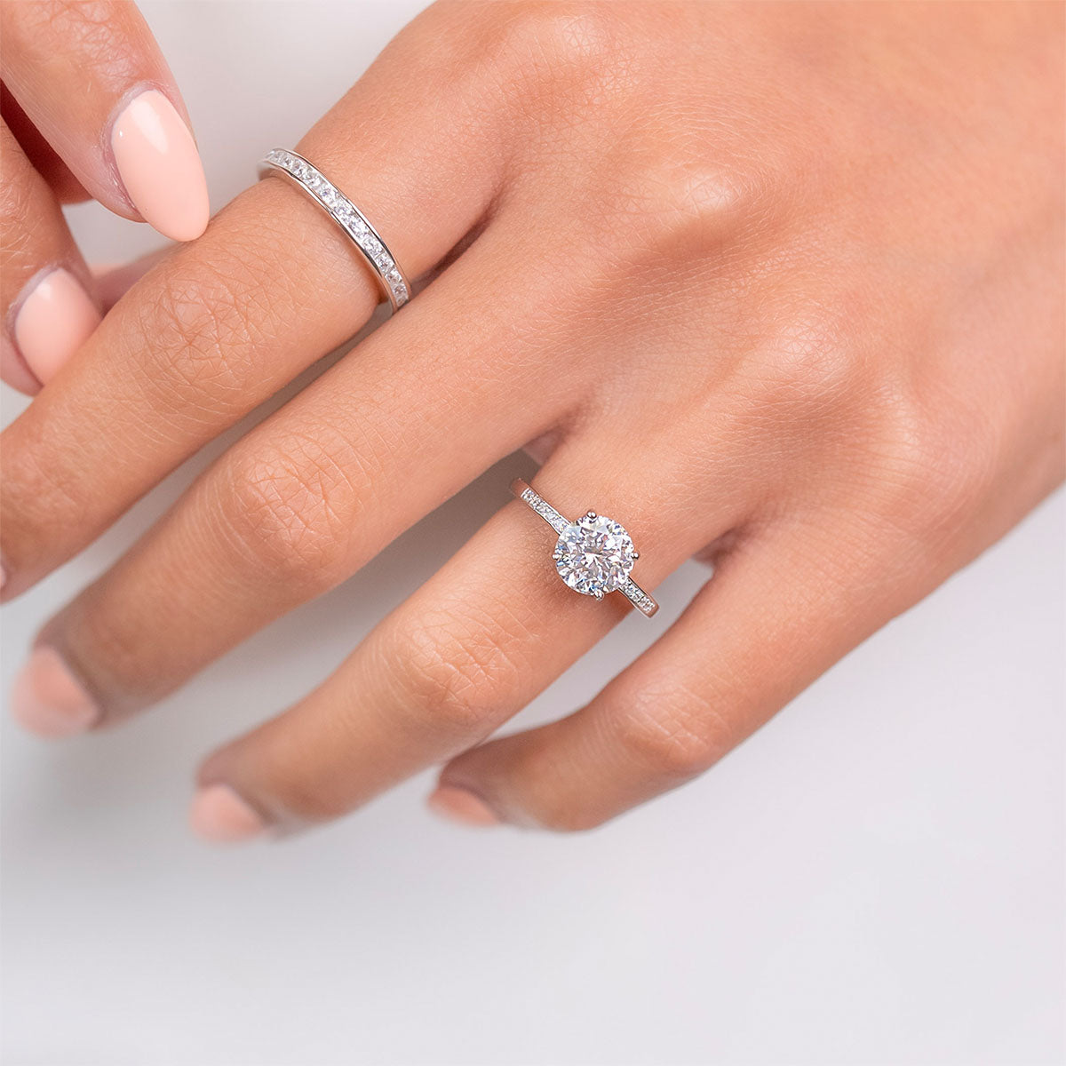Cute silver wedding band on hand