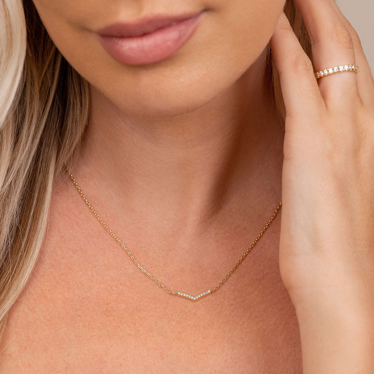Shimmering v shaped necklace on model