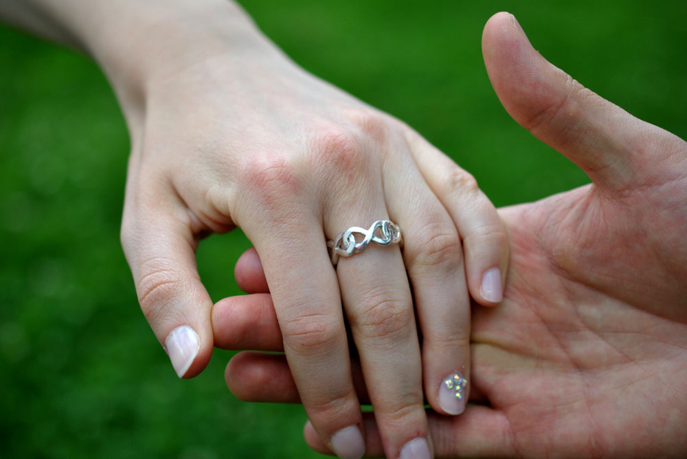 Man holding woman's hand