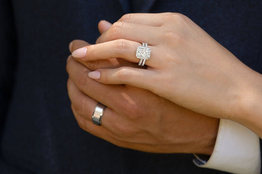 bride and groom rings on hands