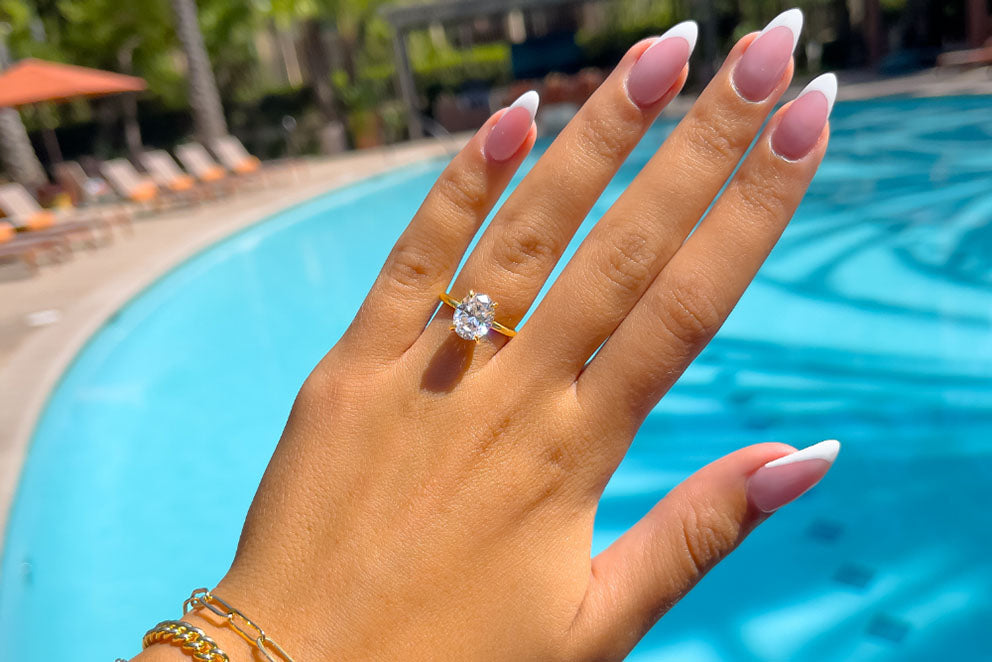 hand wearing engagement ring