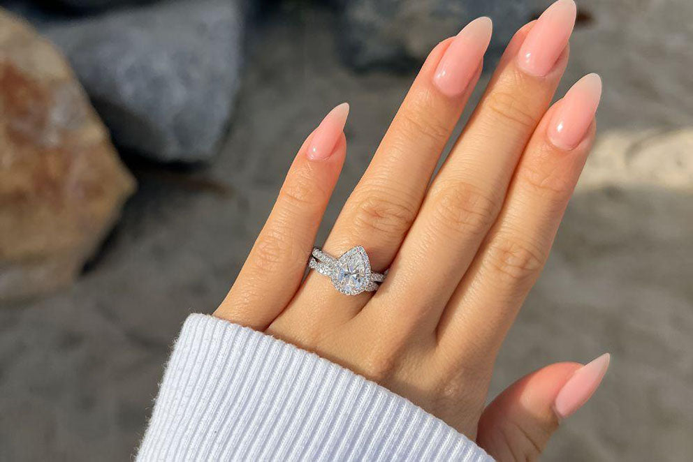 hand wearing ring with large diamond