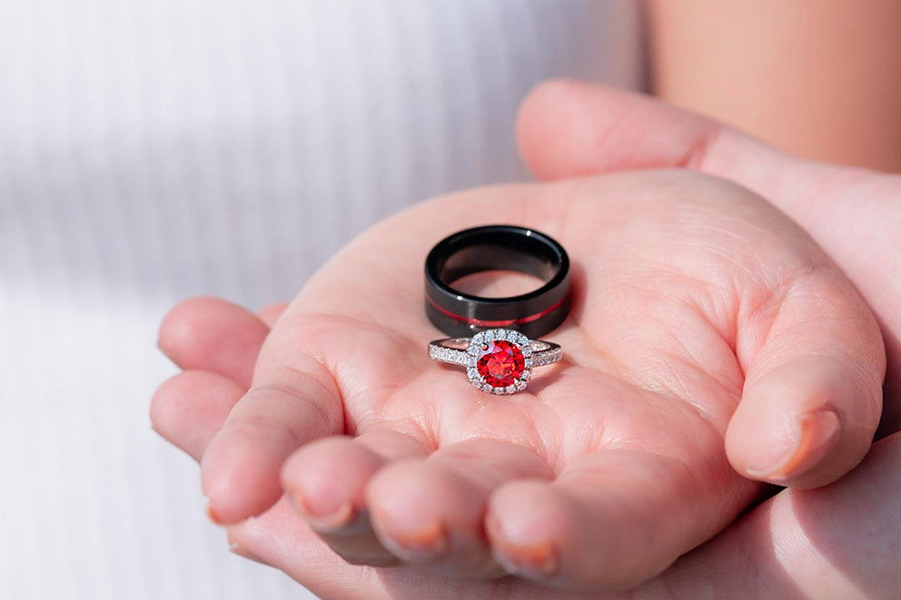 hands holding wedding rings