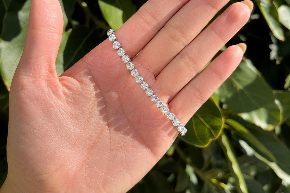 white gold tennis bracelet wrapped around hand