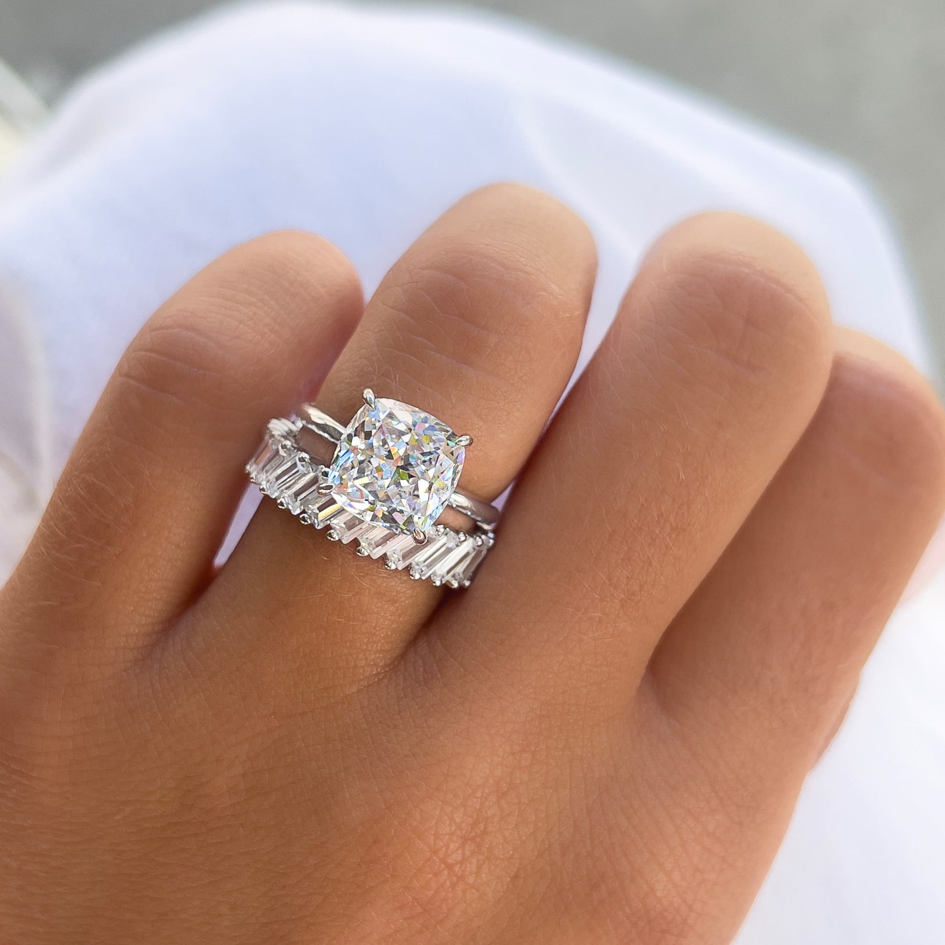 silver cushion cut solitaire engagement ring with a silver baguette band