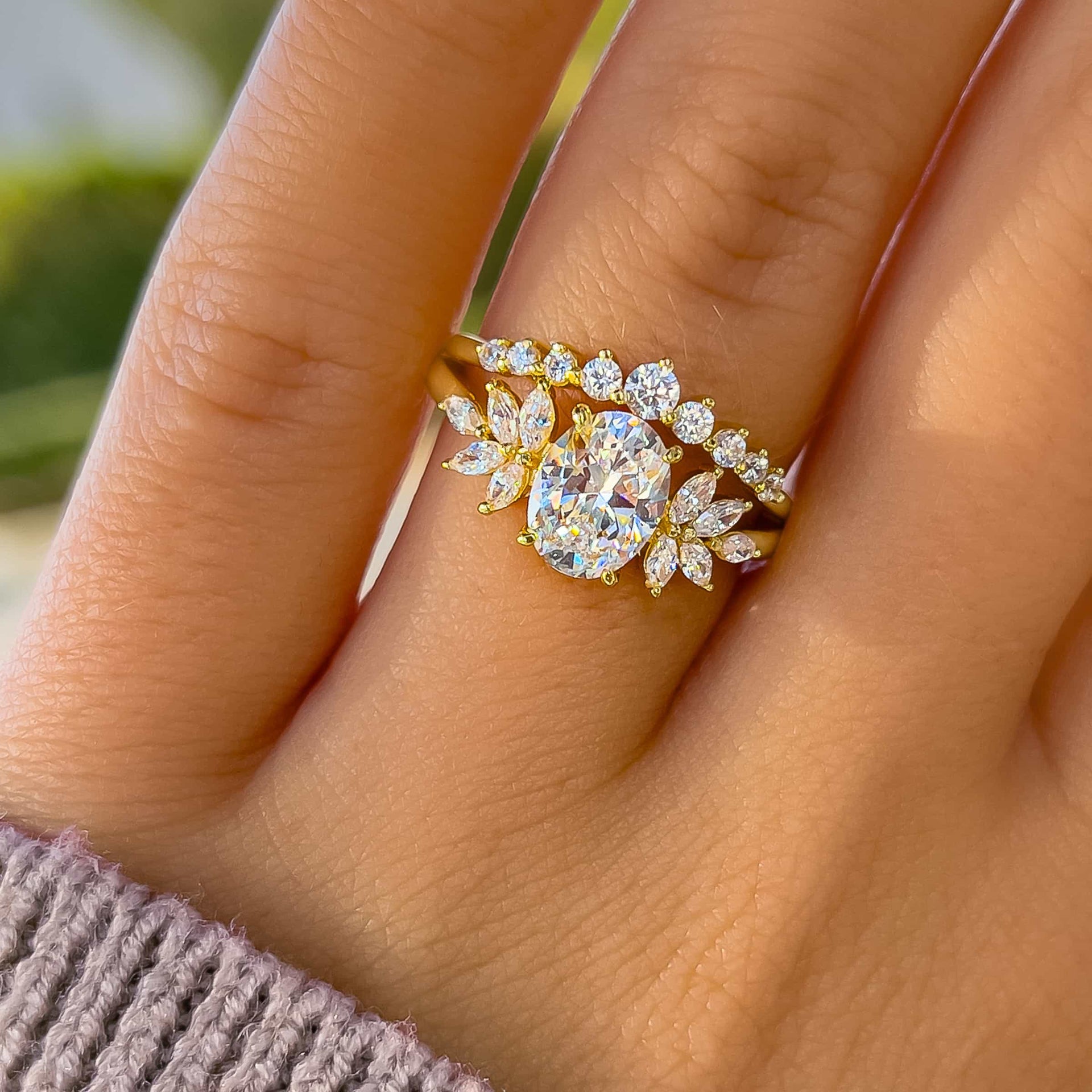 gorgeous gold vintage 1 carat oval cut split shank engagement ring on model wearing knit sweater