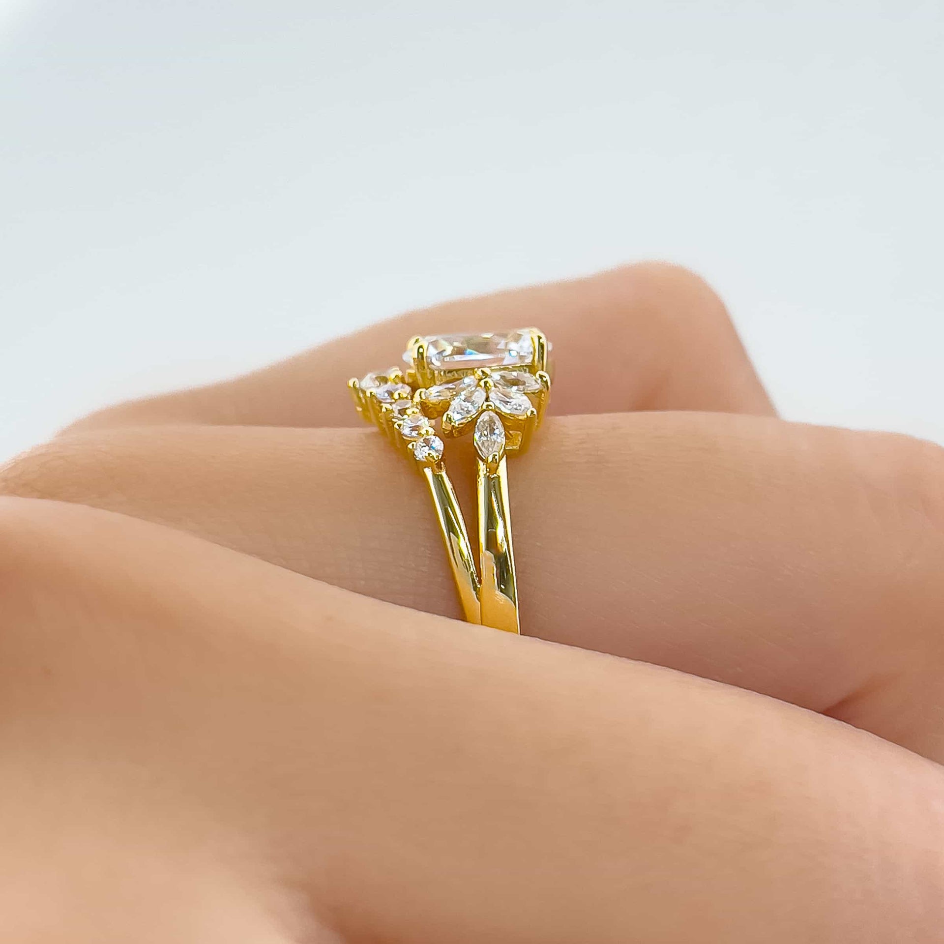 setting shot of gold vintage 1 carat oval cut split shank engagement ring on model