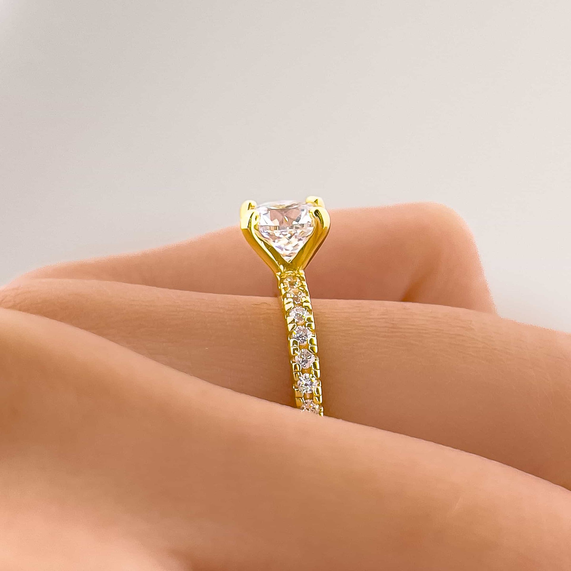 setting shot of gold 1.75 carat round cut engagement ring that is part of The Star Light wedding ring set