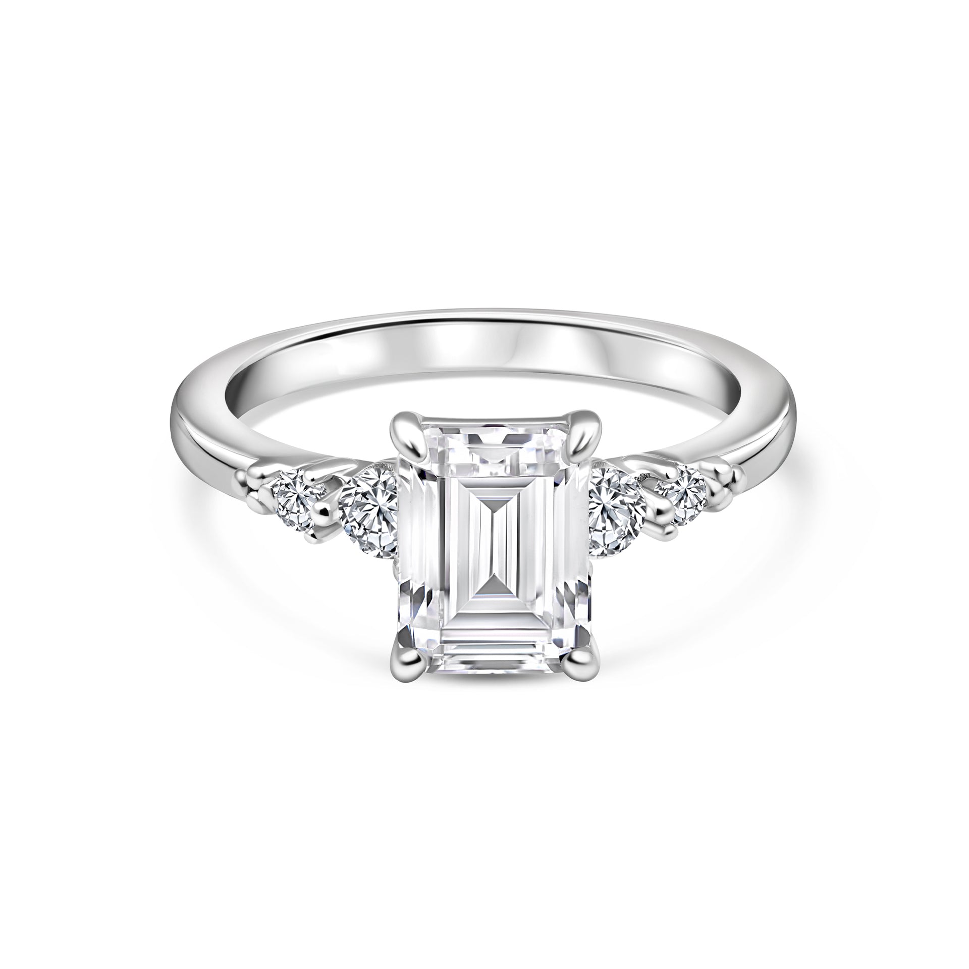 silver 1.5 carat emerald cut engagement ring with round accent stones on both sides