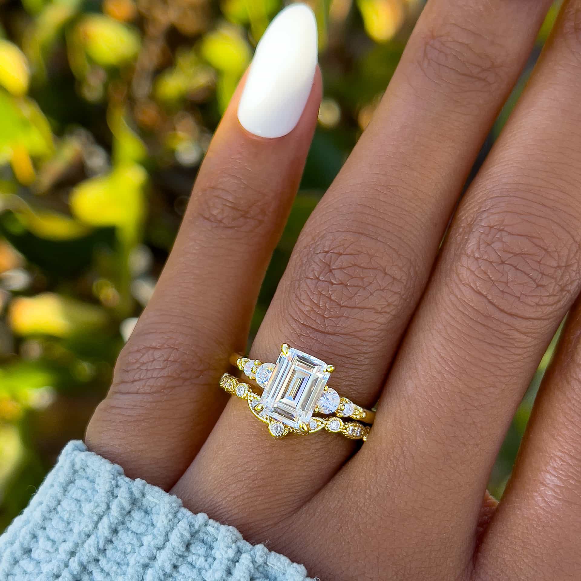 Gorgeous gold wedding ring set made of emerald cut engagement ring and vintage chevron style engagement ring