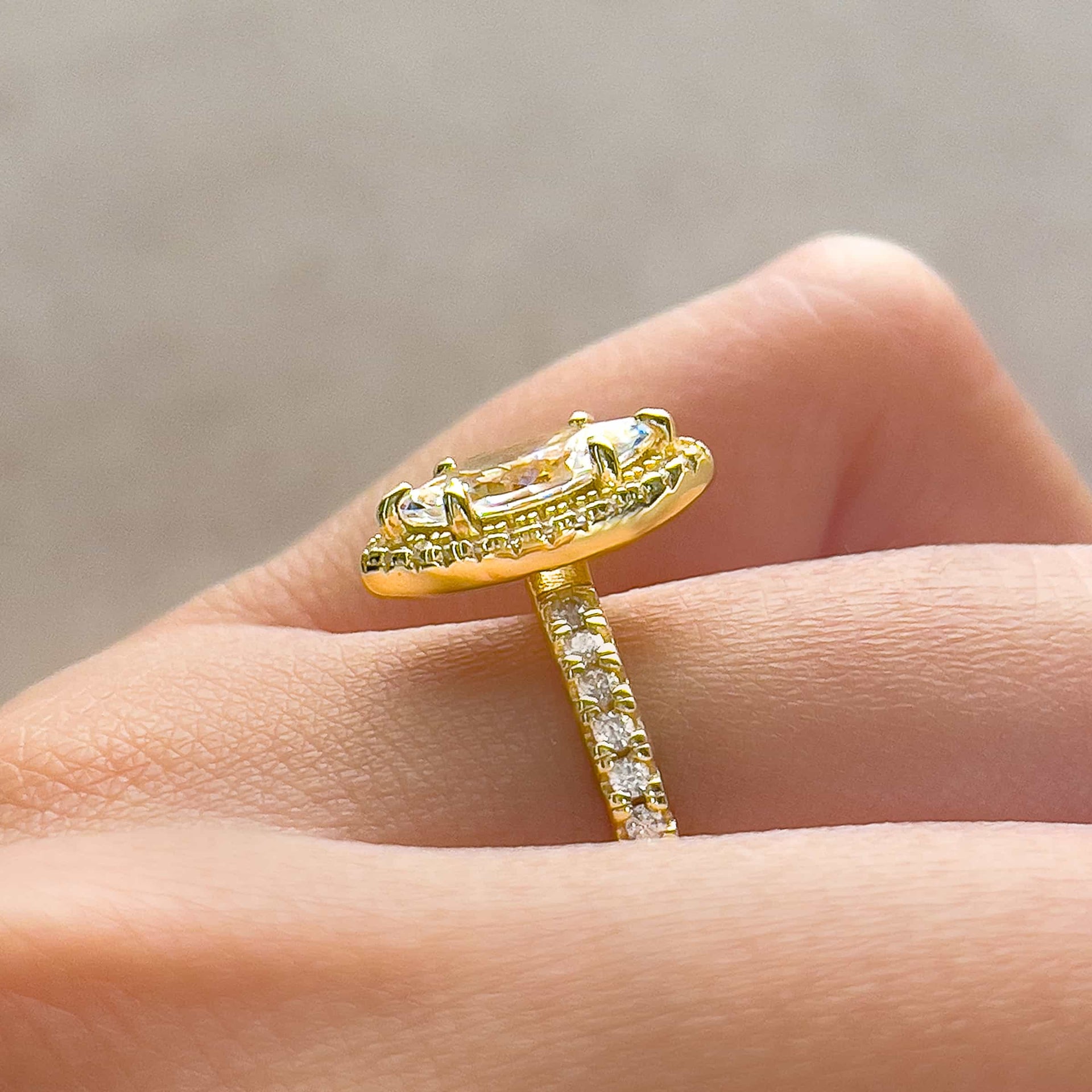 side profile shot of 1 carat gold marquise cut engagement ring