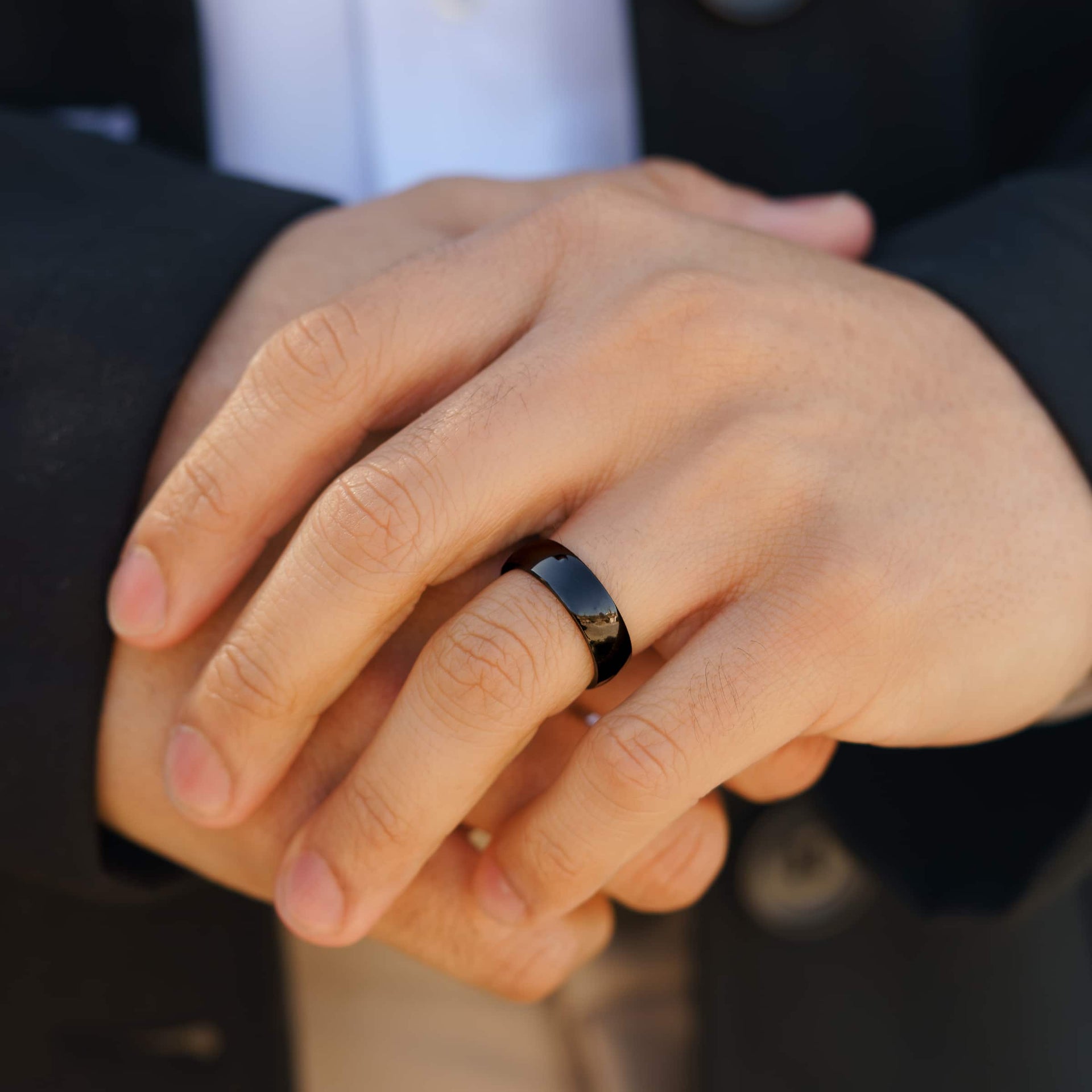 affordable black mens Horizon wedding ring on model's hand with suit