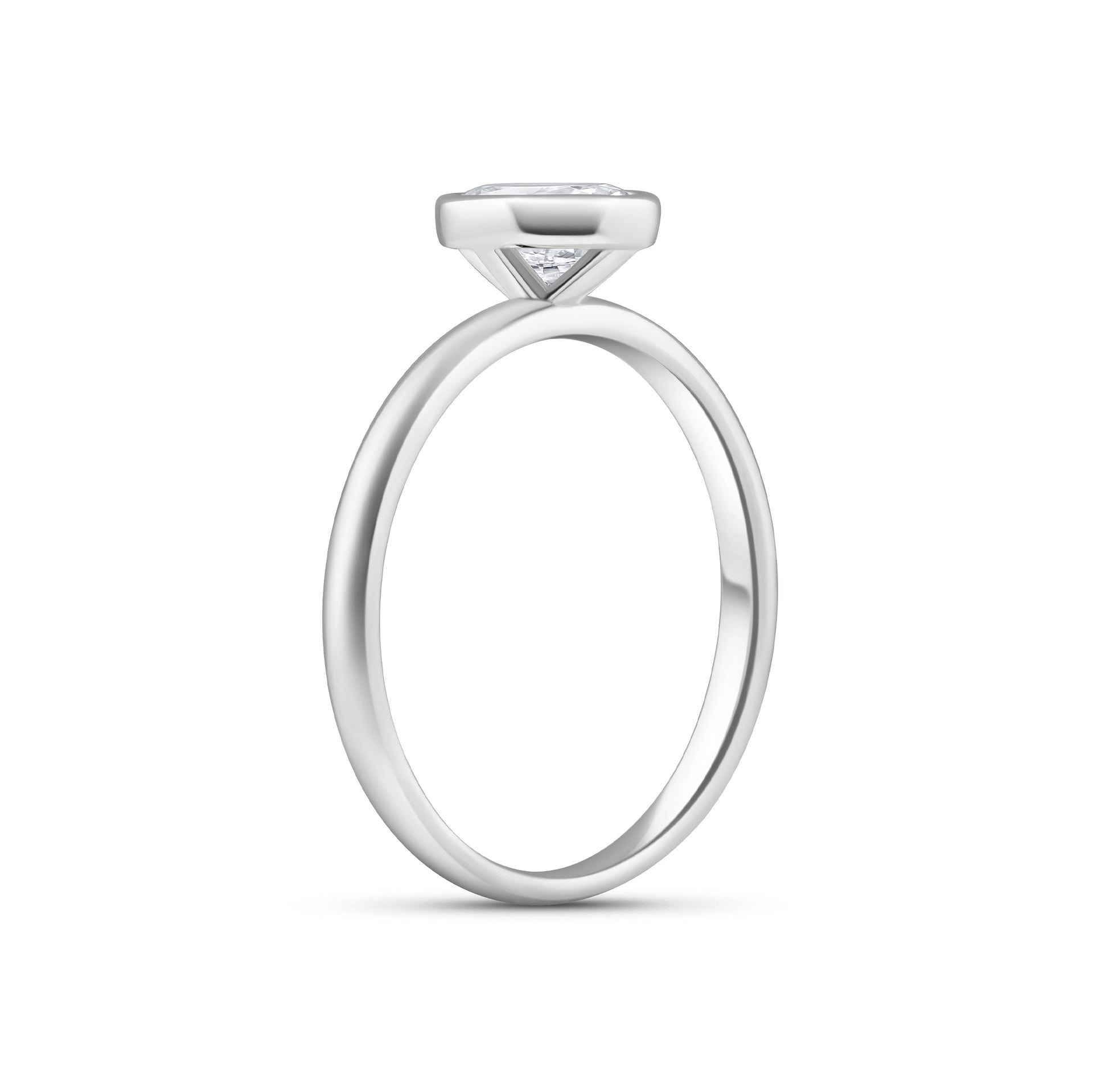 silver 1.5 carat oval cut engagement ring with bezel setting on white background