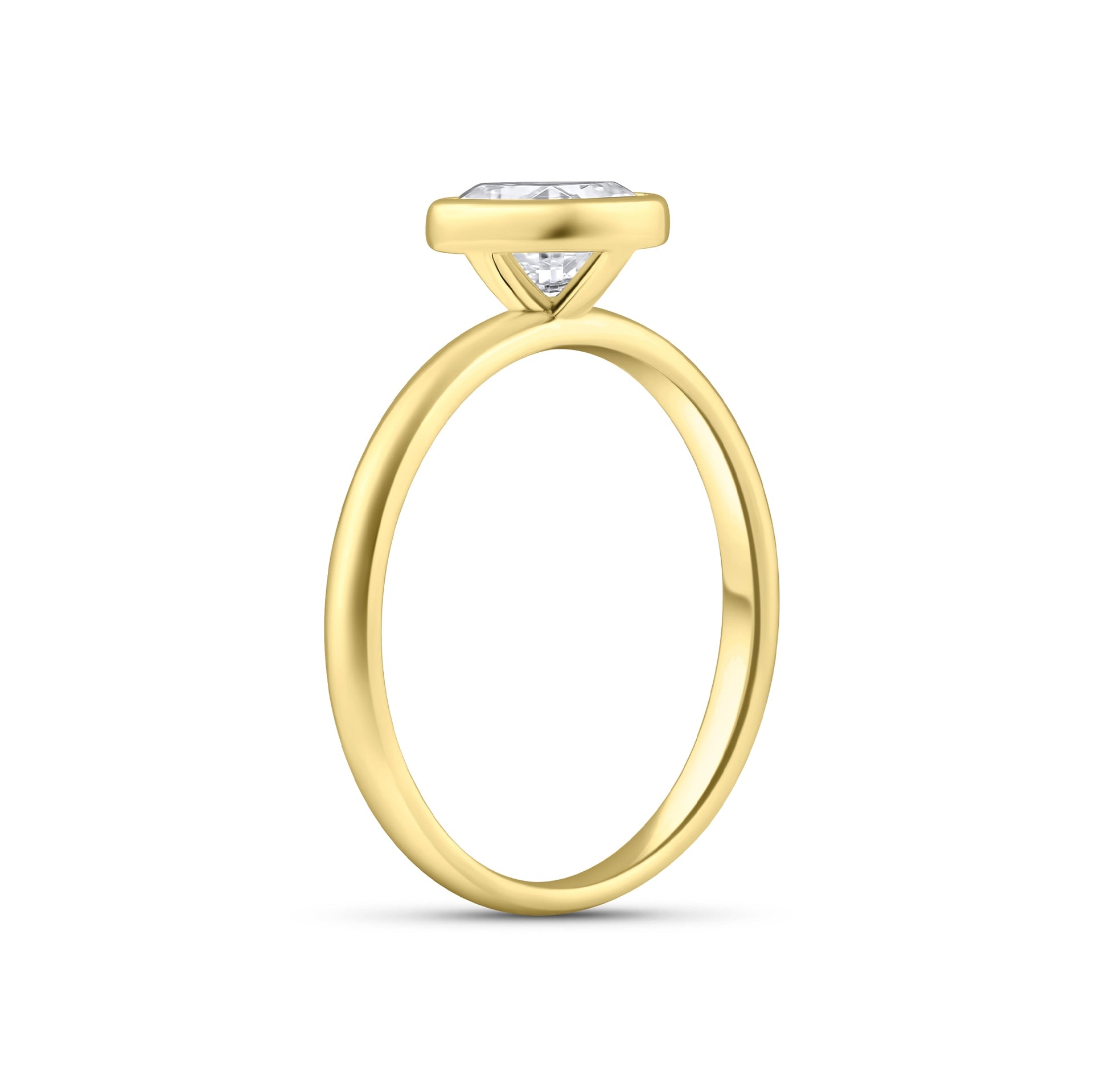 gold 2 carat cushion cut engagement ring with bezel setting on white background 