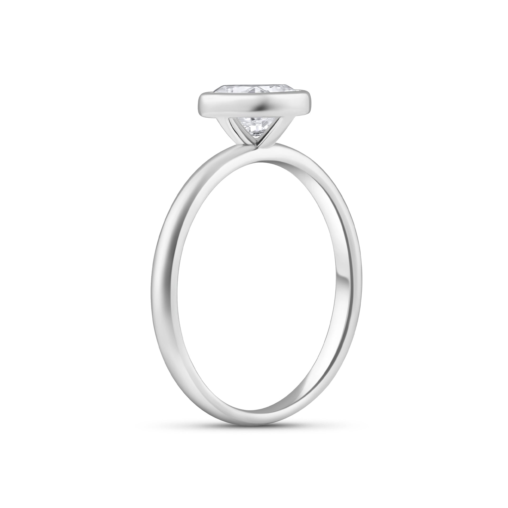 2 carat cushion cut engagement ring with bezel setting on white background 
