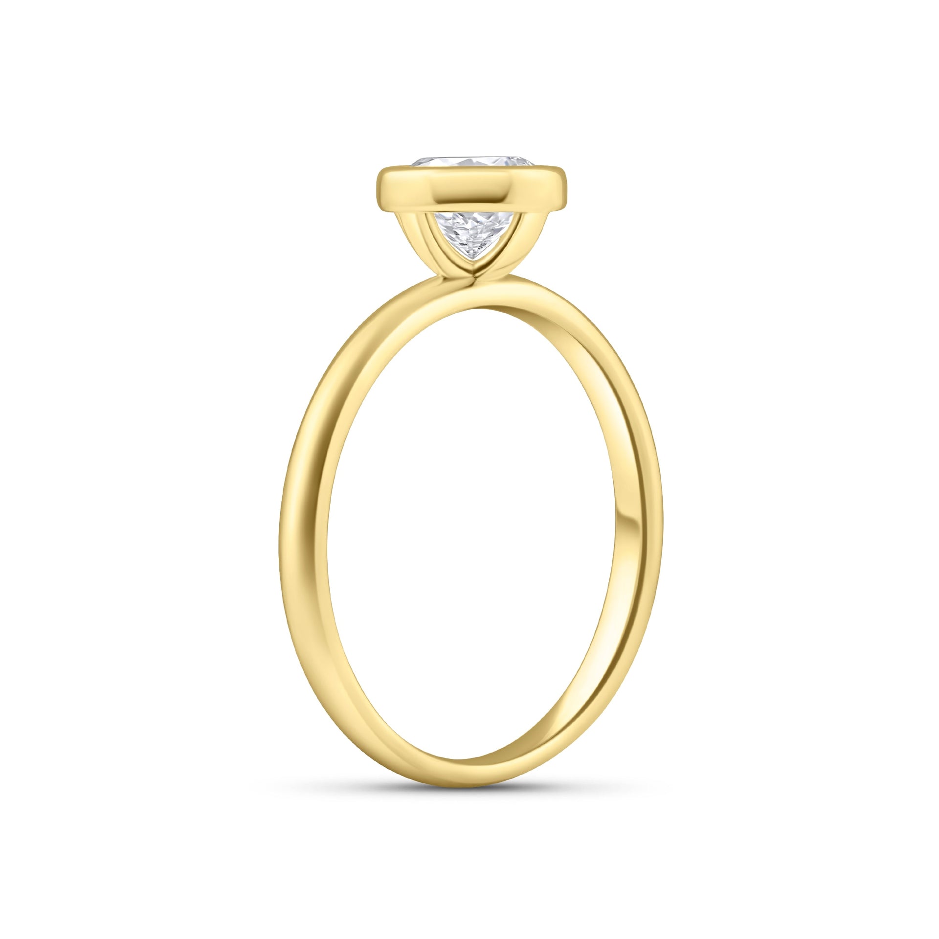 gold 1.25 carat round cut stone in a bezel setting on white background