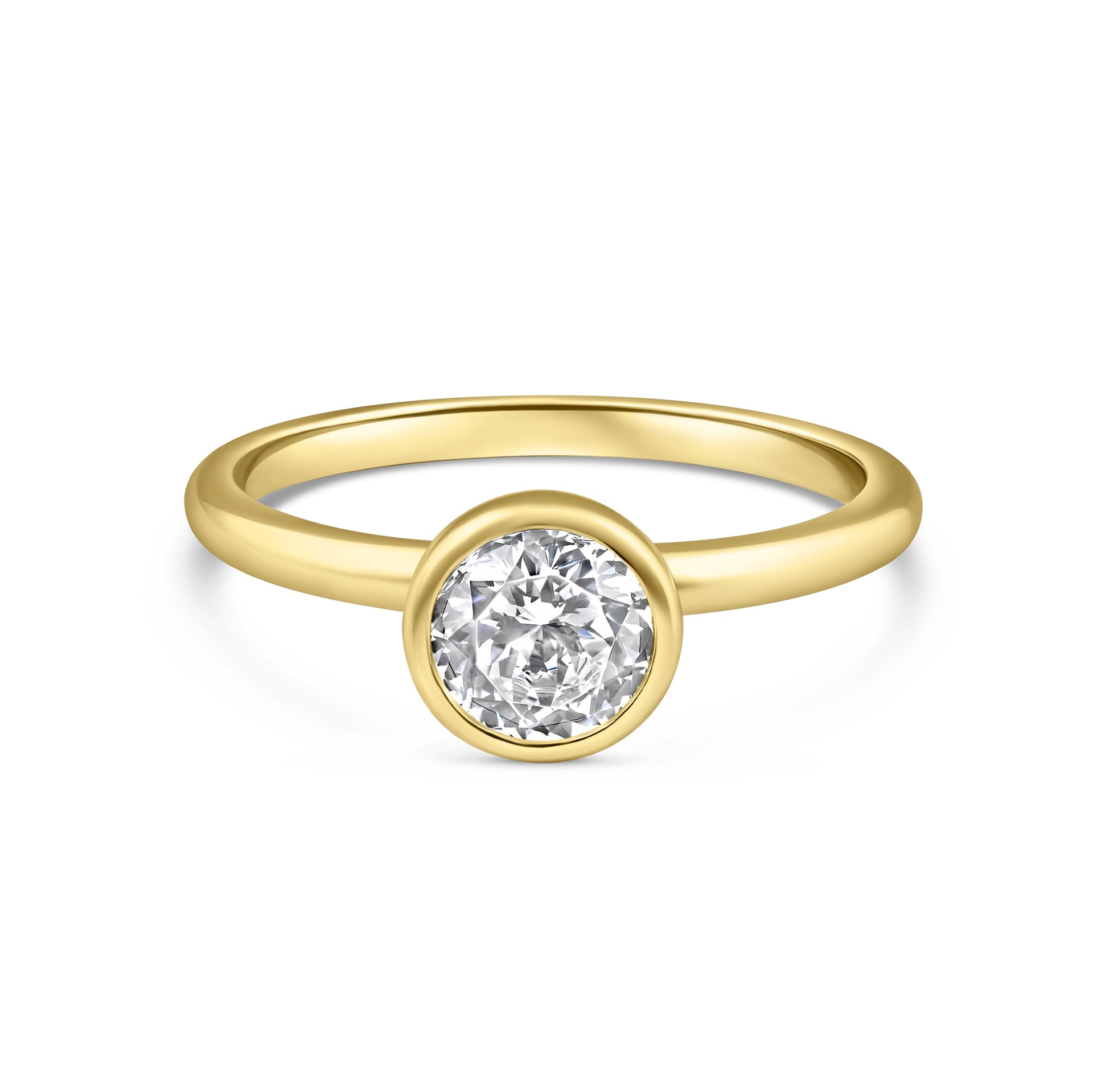 gold 1.25 carat round cut stone in a bezel setting on white background