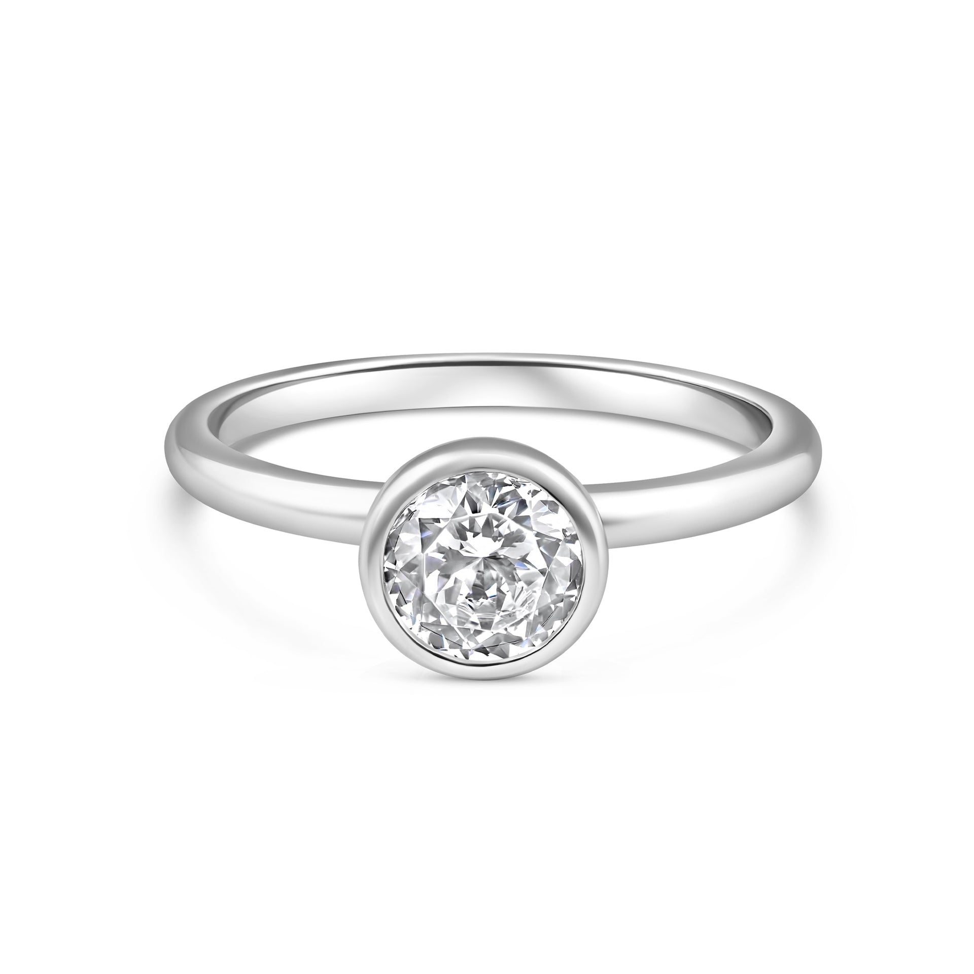silver engagement ring with 1.25 carat round cut stone in a bezel setting on white background