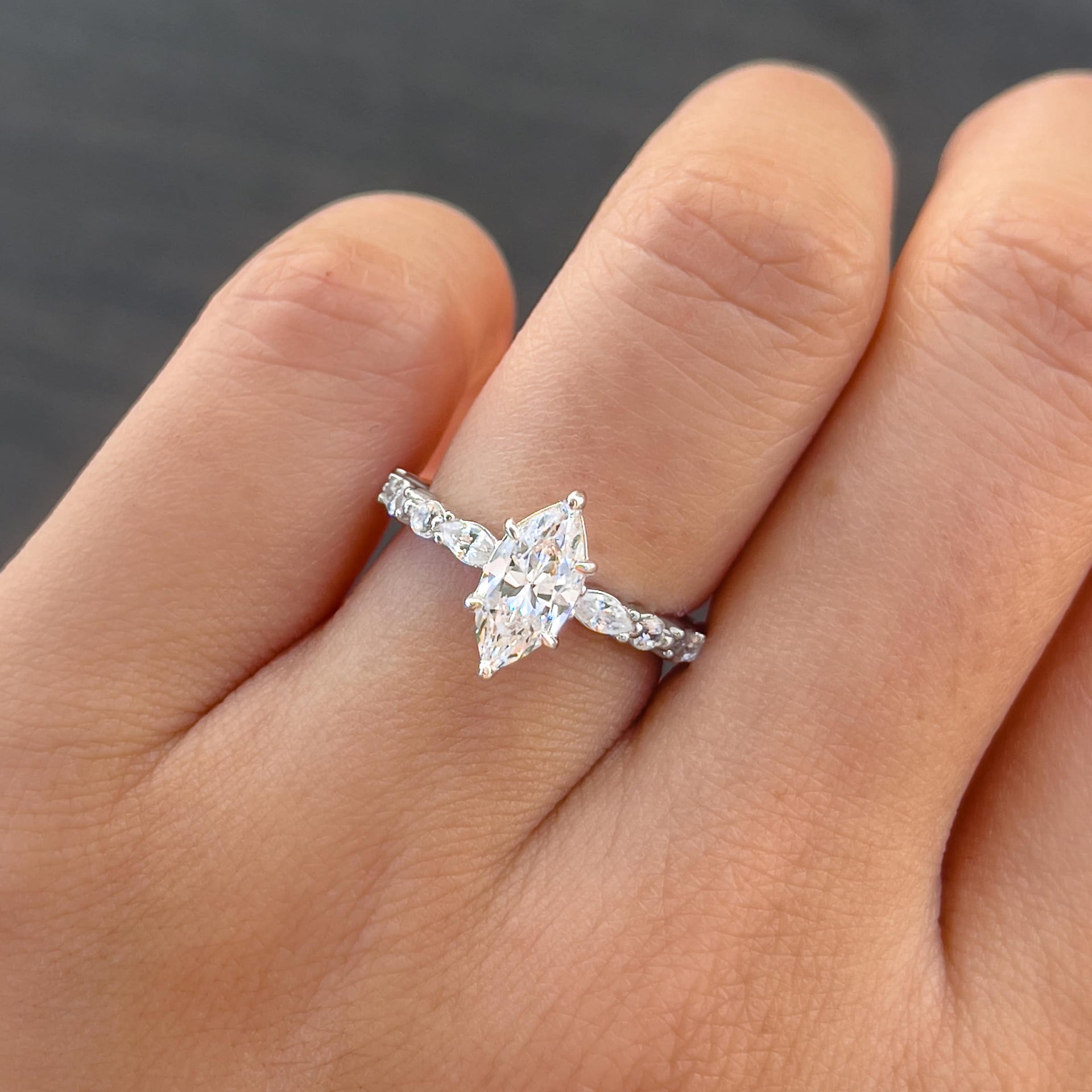 stunning 1 carat marquise cut half eternity vintage engagement ring on female model