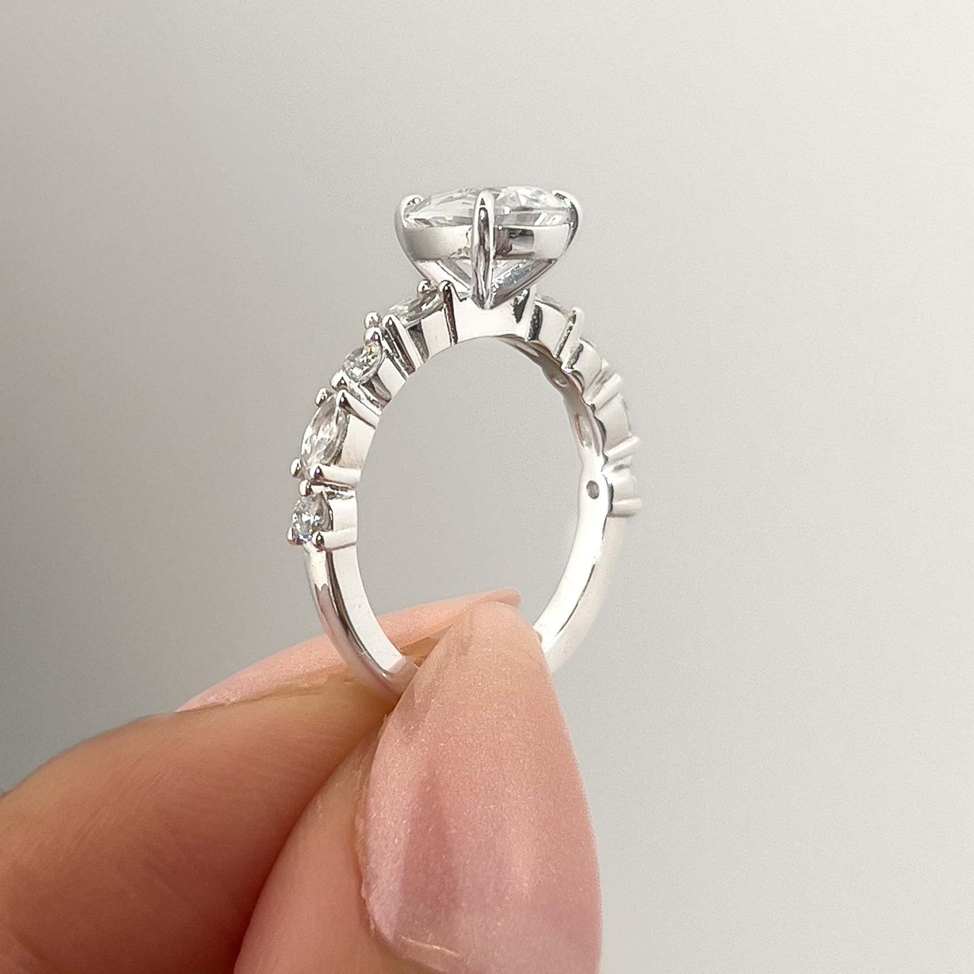 setting shot of silver vintage pear cut engagement ring
