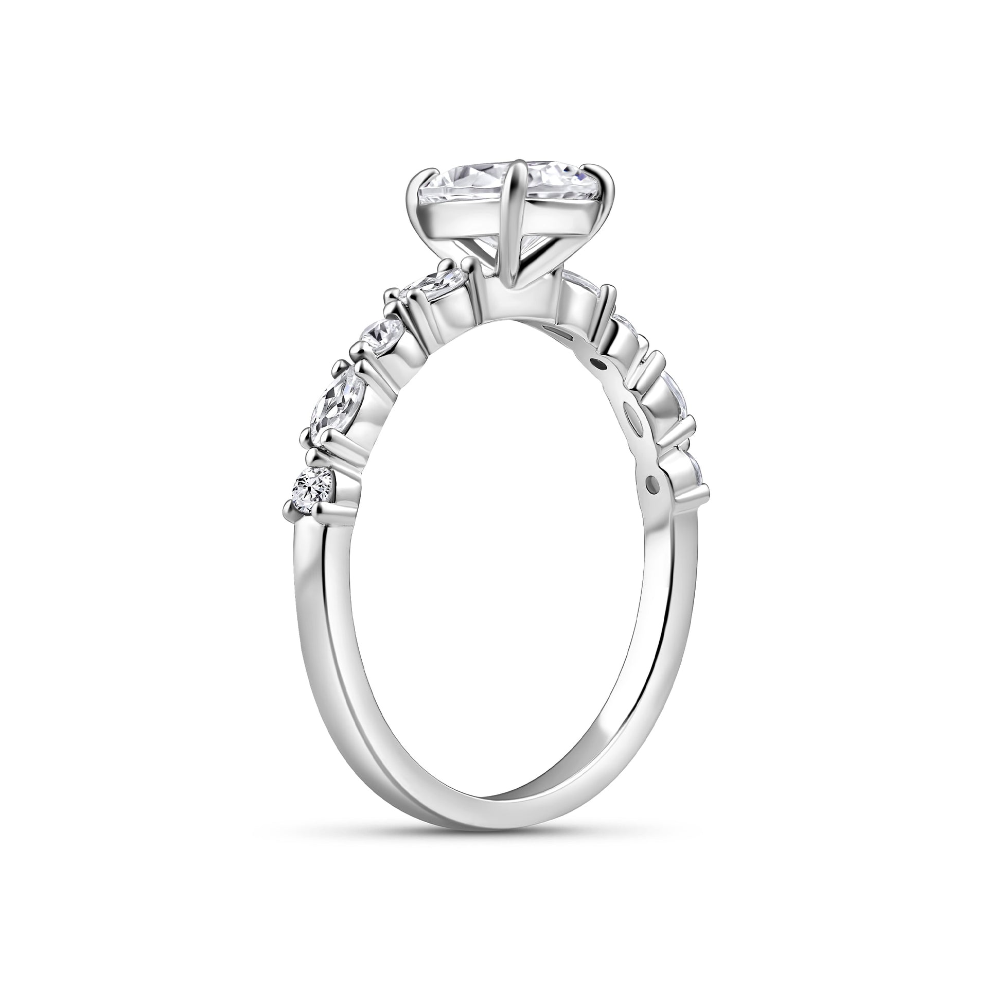 side view of 1.5 carat pear cut engagement ring on white background