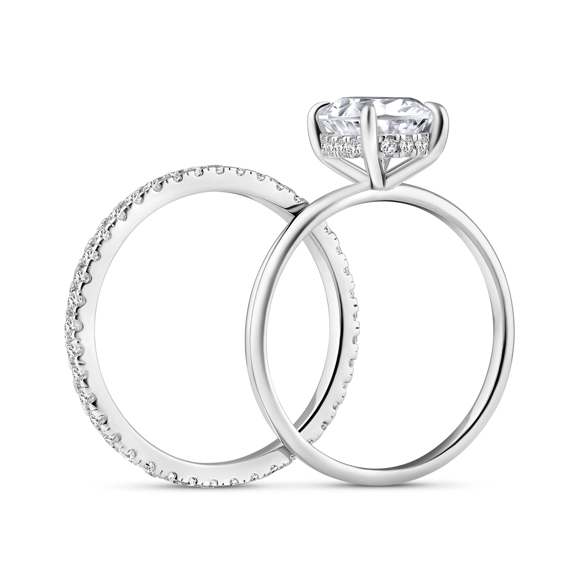 side view of classic silver 3 carat oval cut hidden halo solitaire wedding ring set on white background