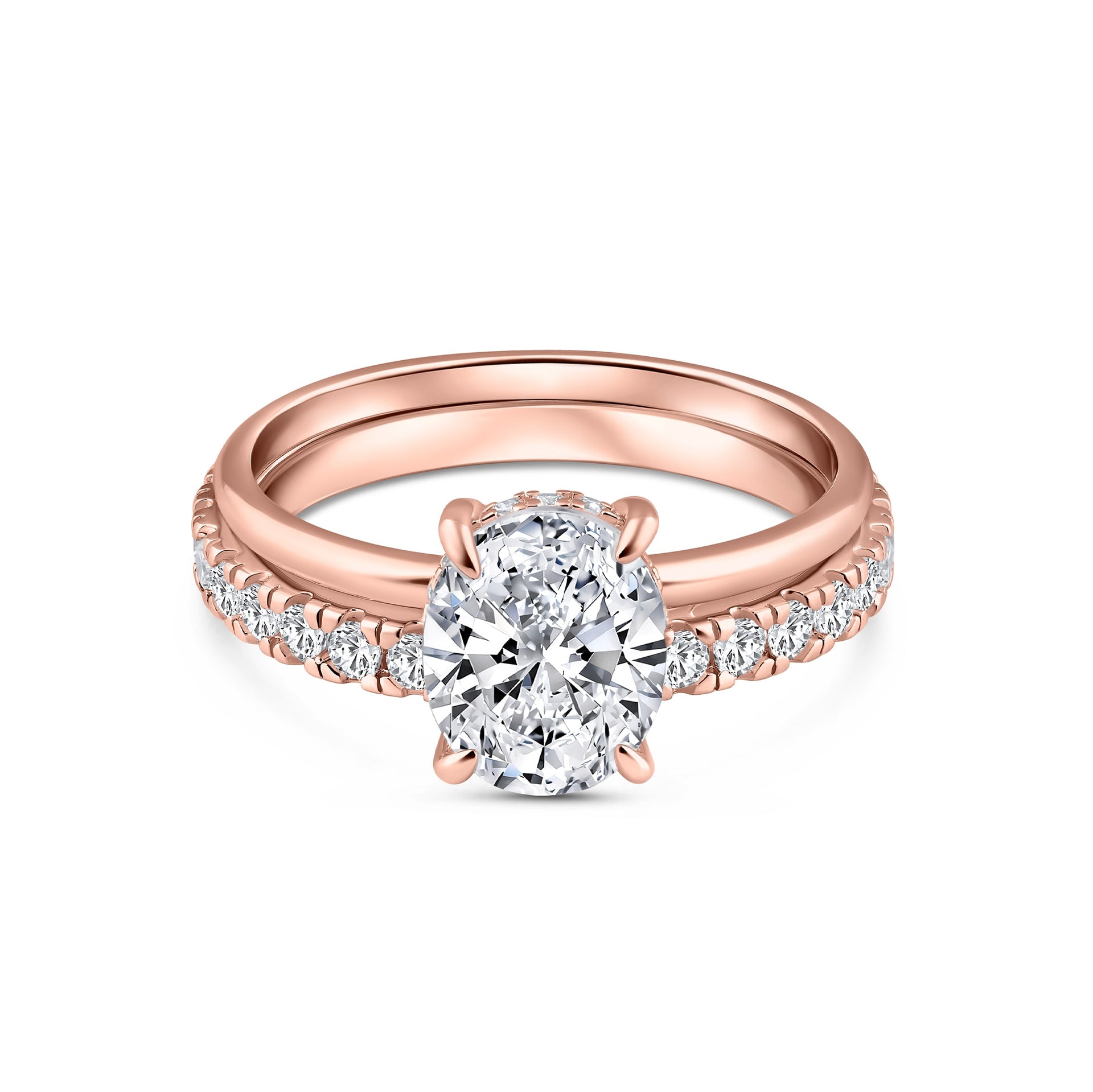 classic rose gold 3 carat oval cut wedding ring set with solitaire engagement ring and full eternity wedding band on a white background