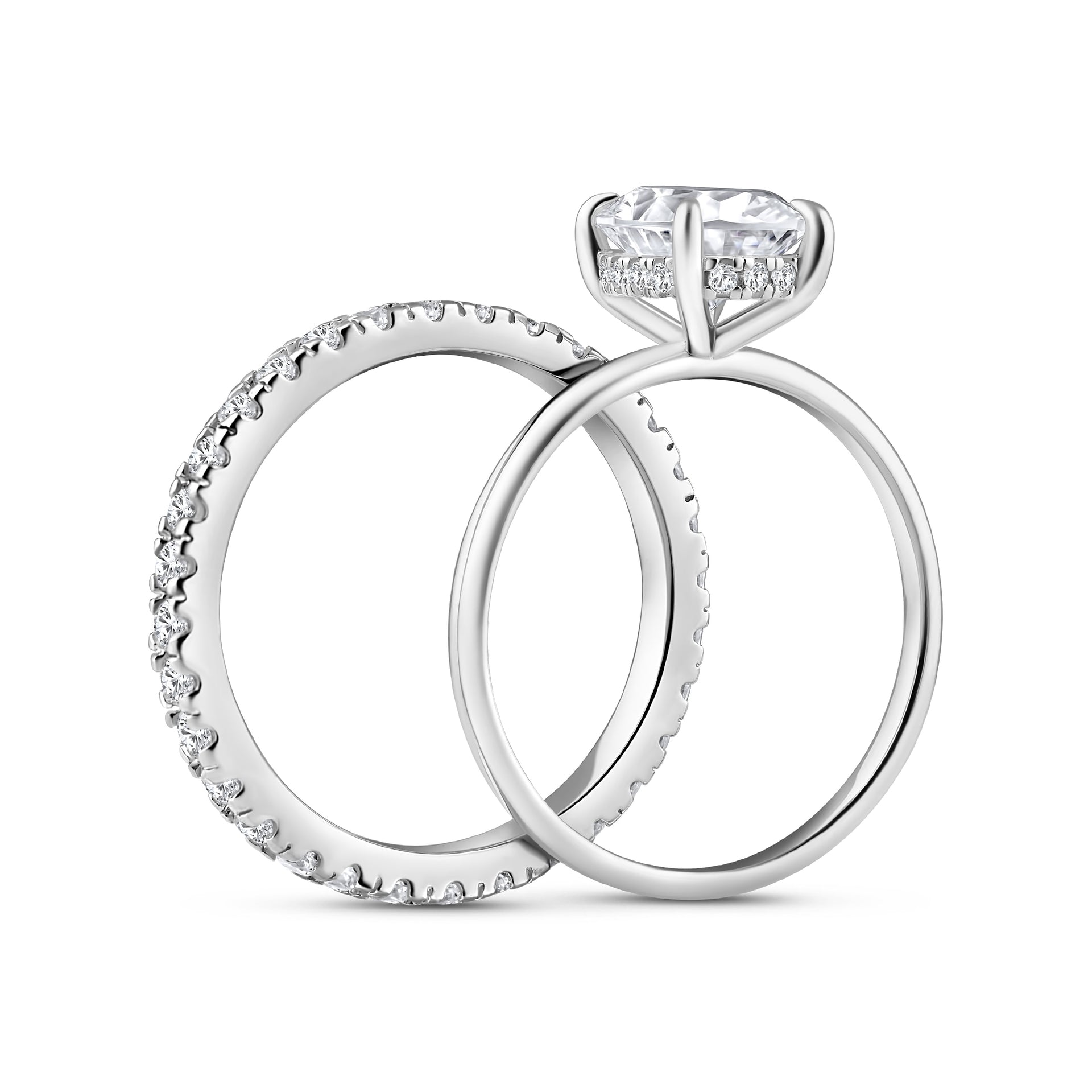 side view of silver 3 carat oval cut wedding ring set with solitaire engagement ring and full eternity wedding band on a white background