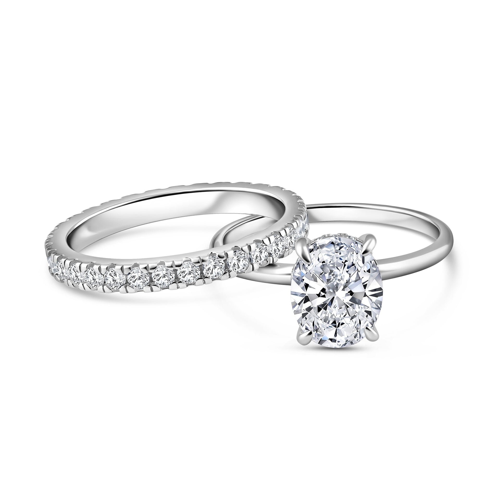 alternate pose of silver 3 carat oval cut wedding ring set with solitaire engagement ring and full eternity wedding band on a white background