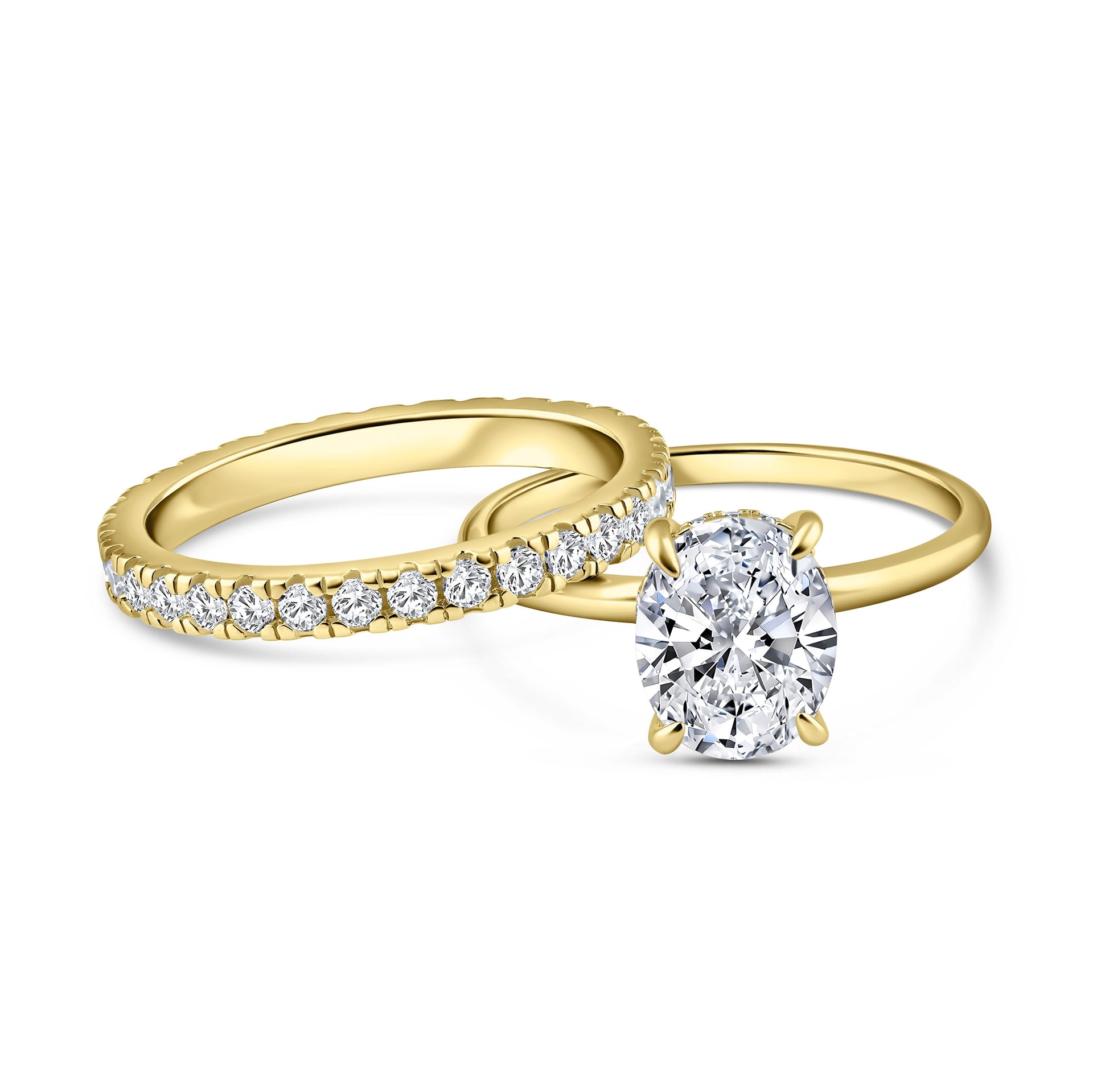 alternative pose of classic gold 3 carat oval cut wedding ring set with solitaire engagement ring and full eternity wedding band on a white background