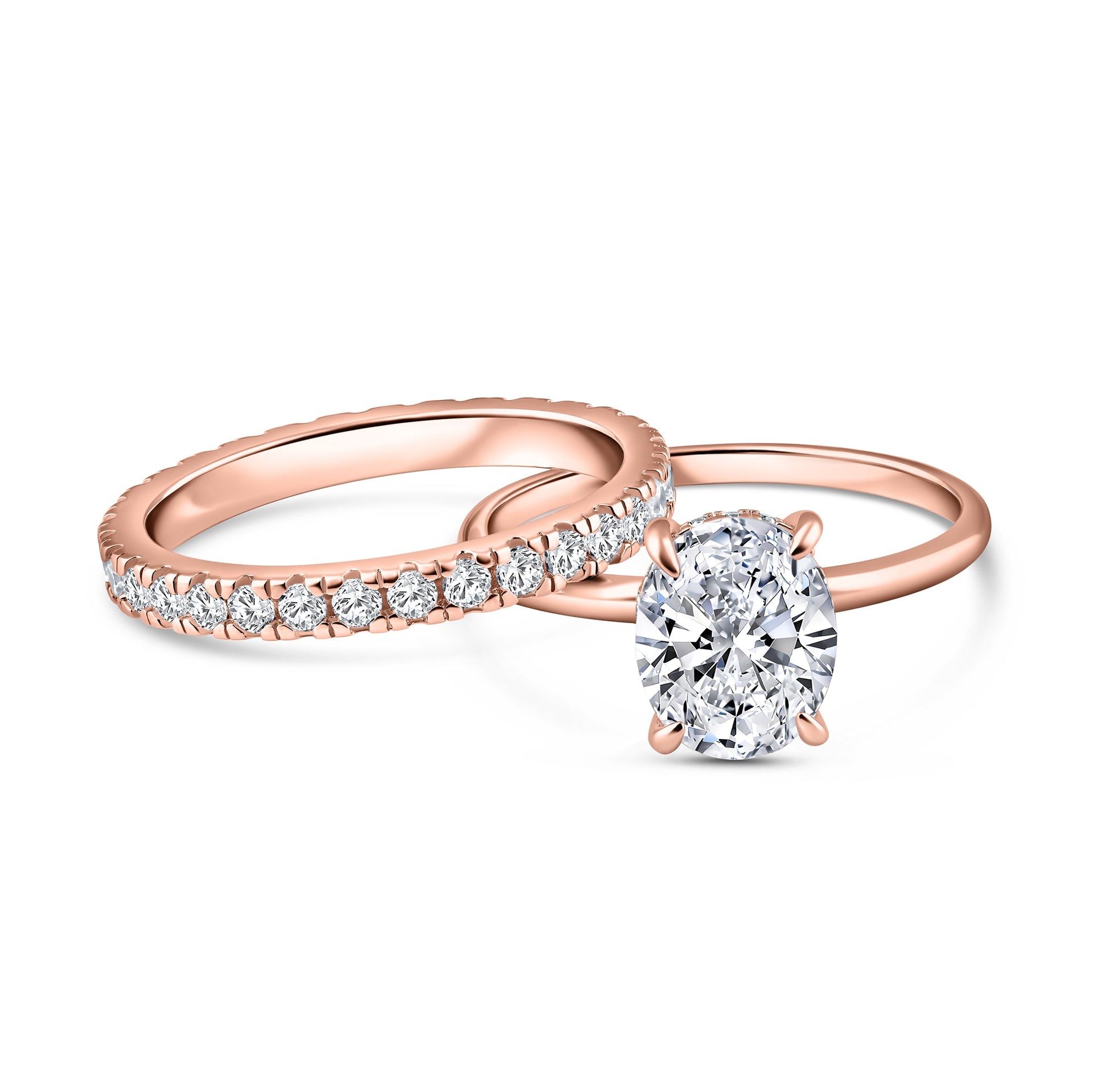 alternative pose of classic rose gold 3 carat oval cut wedding ring set with solitaire engagement ring and full eternity wedding band on a white background