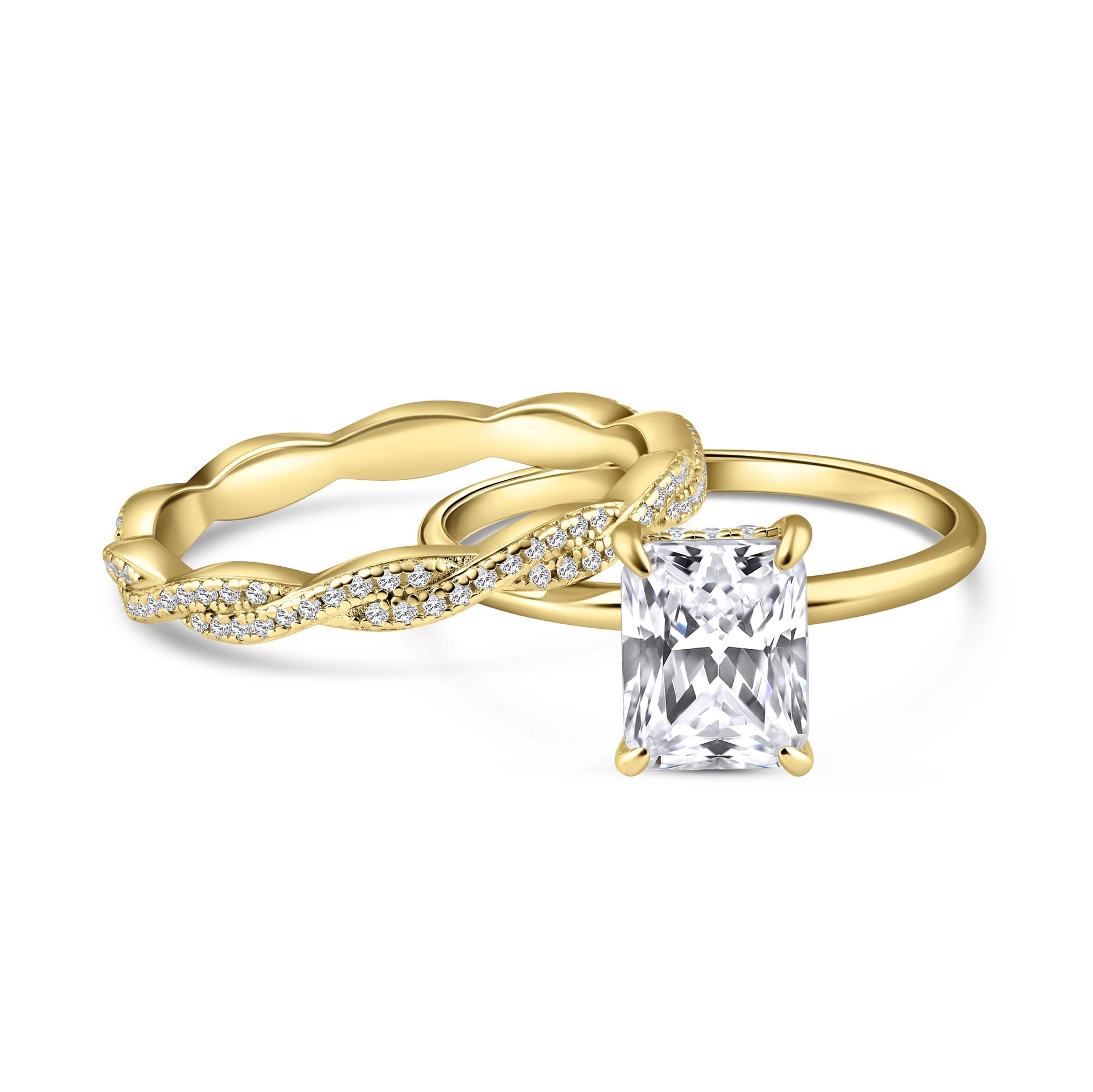 alternative pose of stunning gold 3 carat radiant cut wedding ring set with solitaire engagement ring and full eternity twisting wedding band on a white background