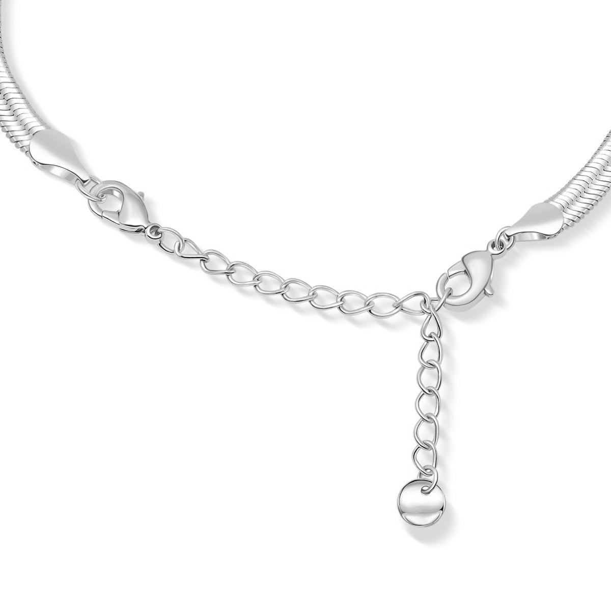 close up view of the chain extender of a silver herringbone detail chain necklace on a white background