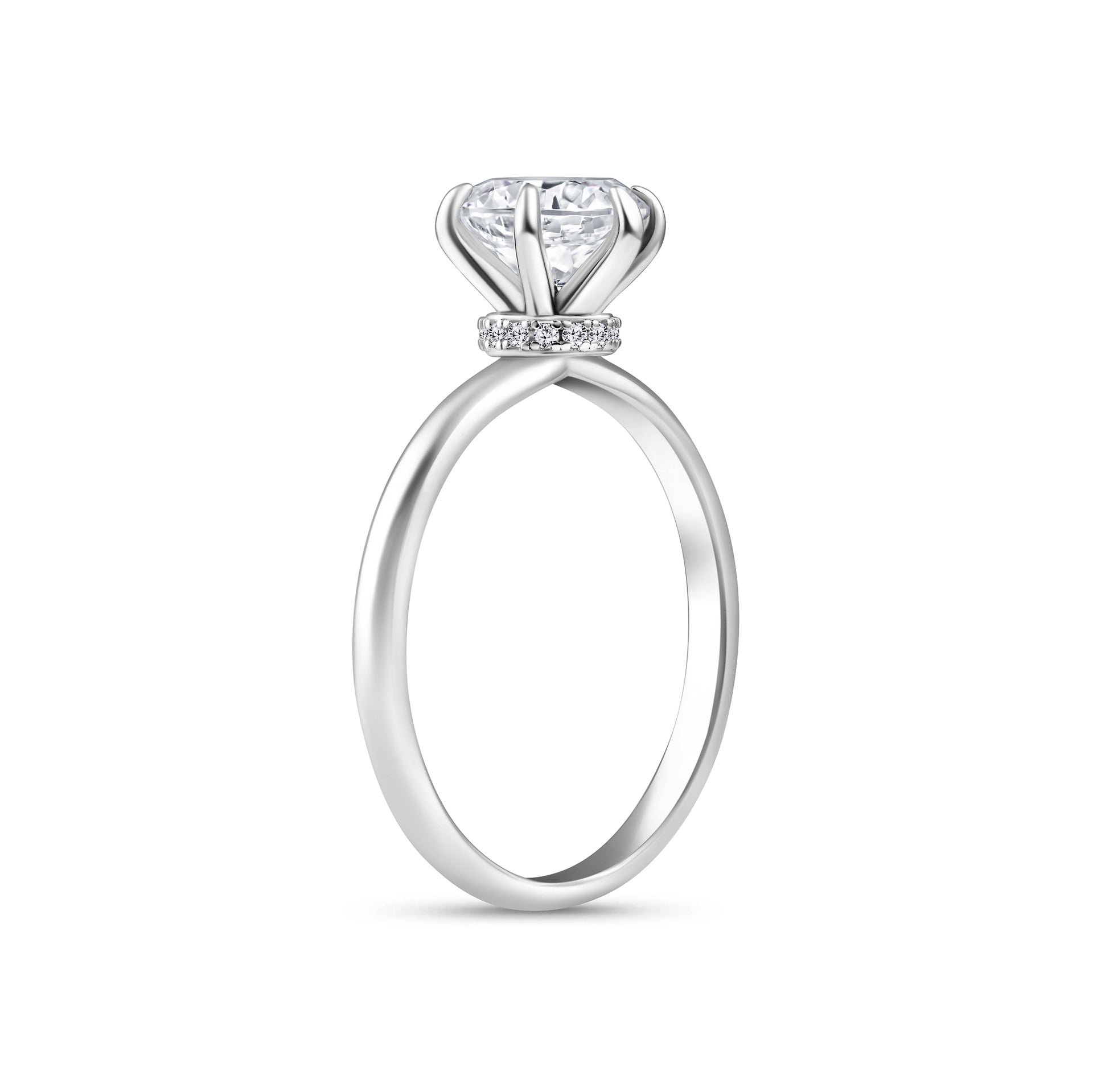 Side view of silver 2 carat round cut engagement ring with secret halo detail on a white background