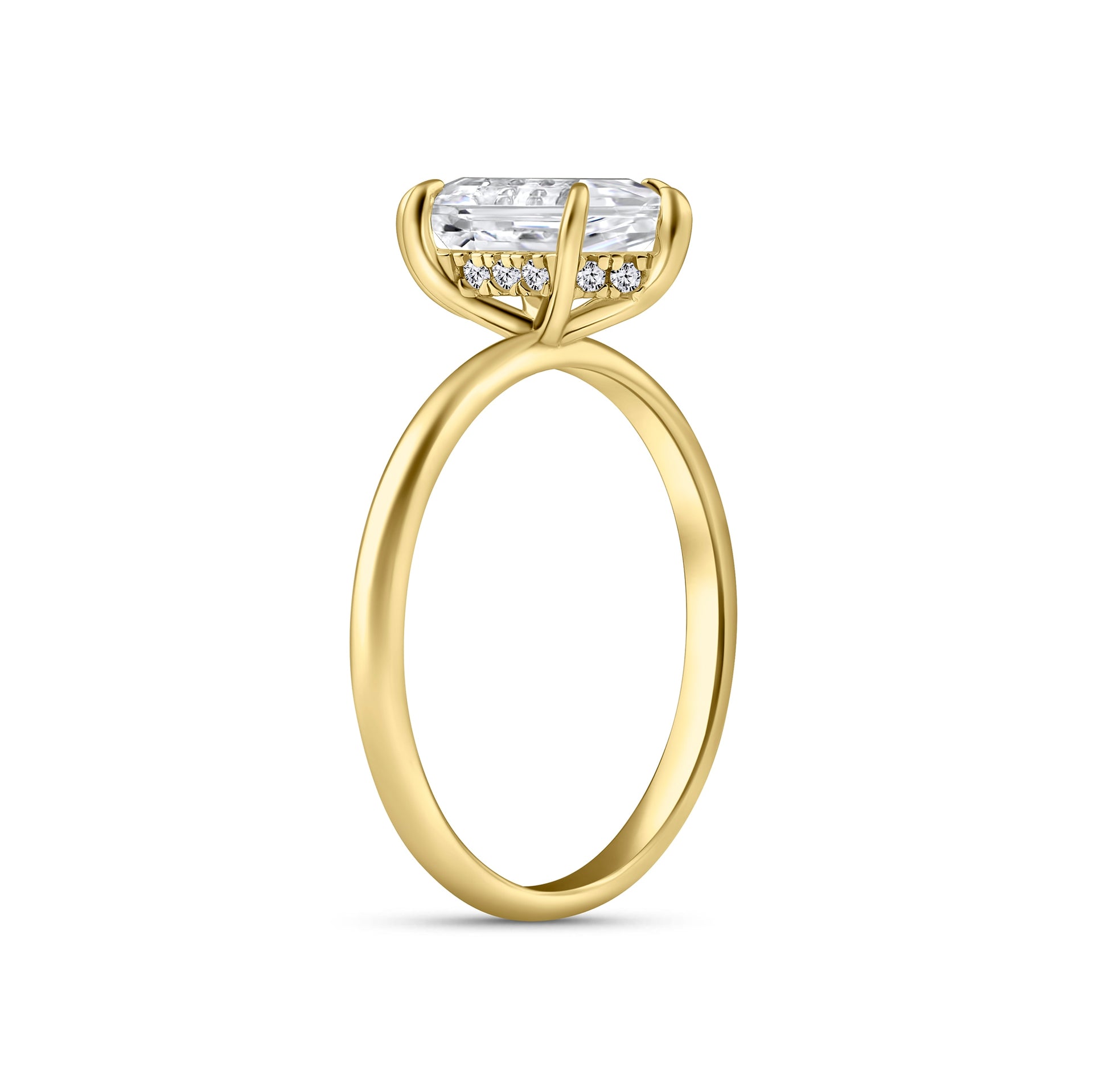 slight side view of a gold 2.5 carat hexagon cut solitaire engagement ring with a hidden halo on a white background