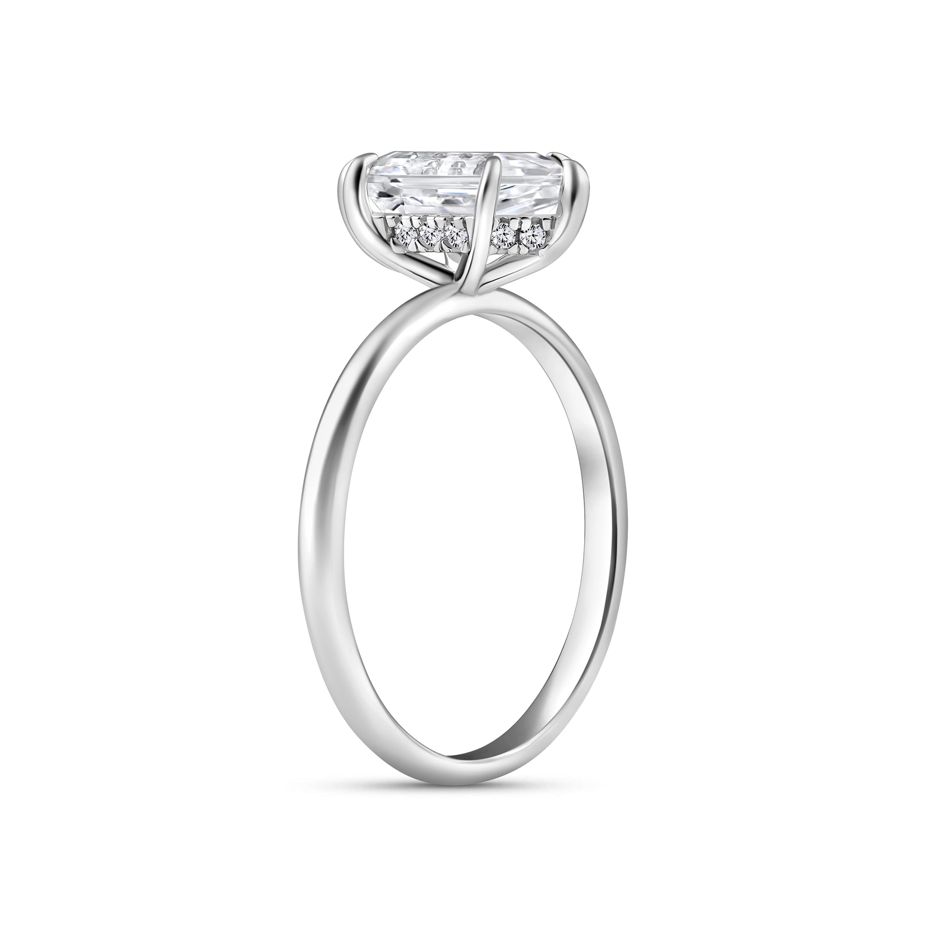 slight side view of a 2.5 carat hexagon cut solitaire engagement ring with a hidden halo on a white background
