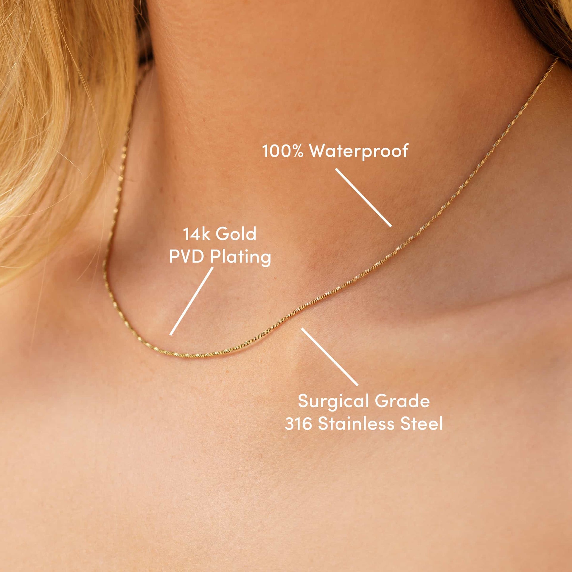 a 14k gold PVD plated stainless steel snake chain necklace worn by a model with the text overlayed "100% waterproof, 14k gold PVD plating, surgical grade 316 stainless steel"
