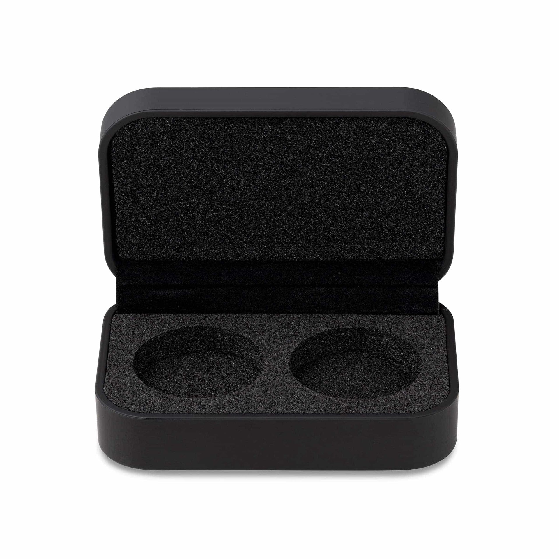 a black ring box opened to show the black padded exterior with two ring slots on a white background