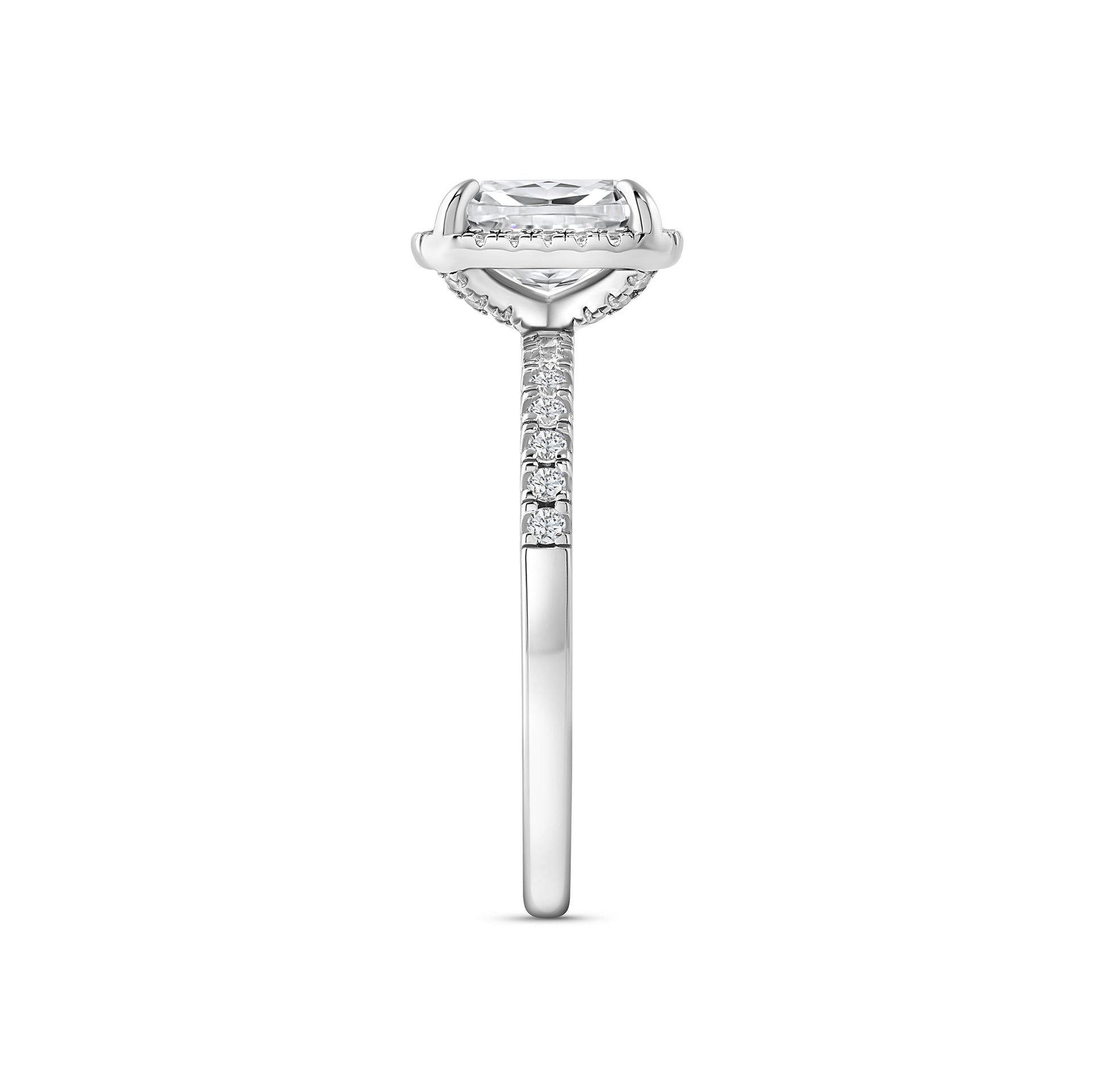 side view of silver 3 carat elongated cushion cut halo engagement ring on white background