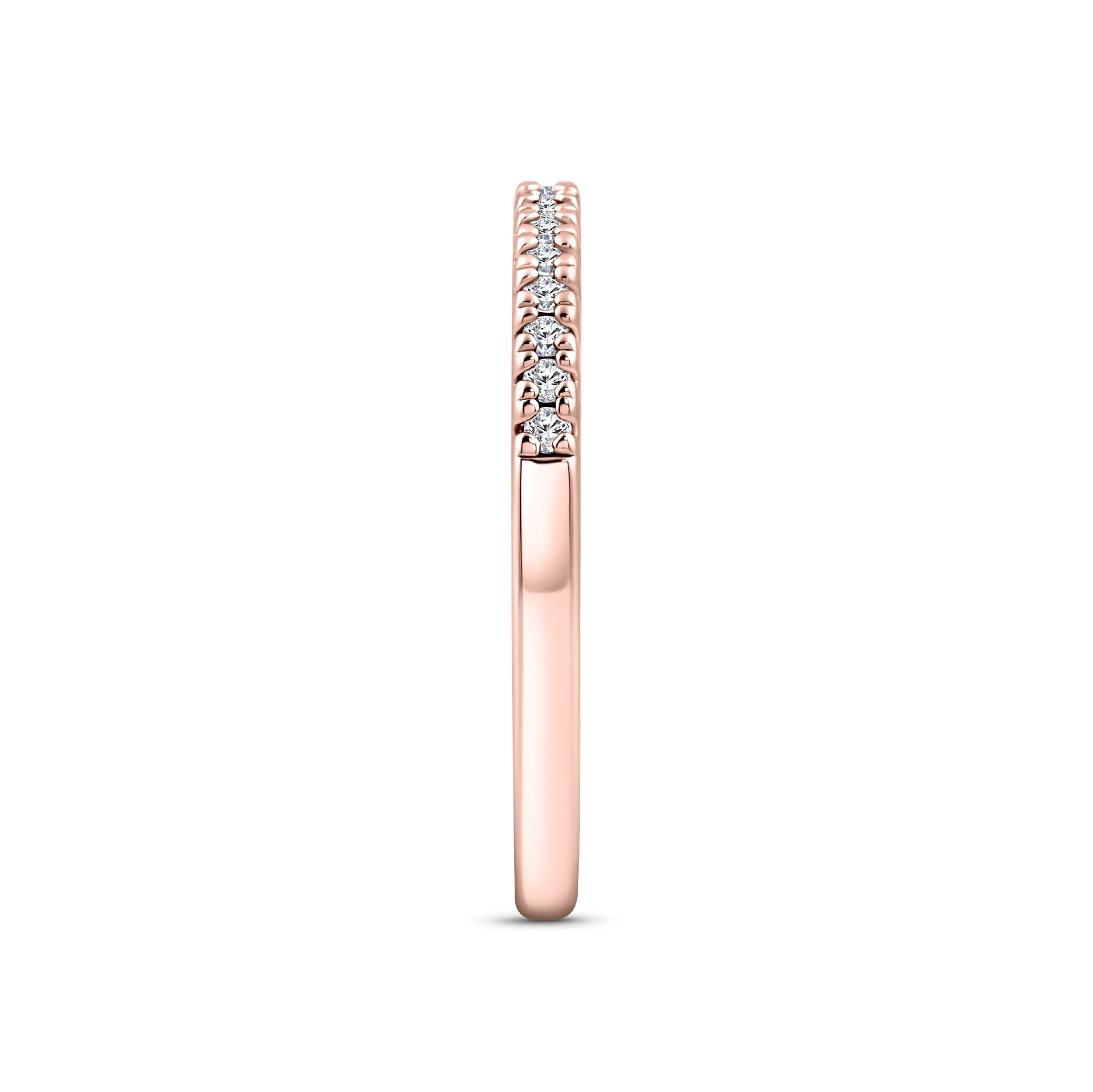 rose gold half eternity wedding band on a white background
